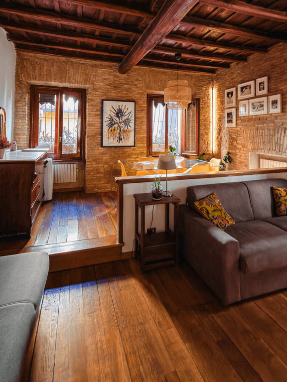White dining table with green velvet chairs