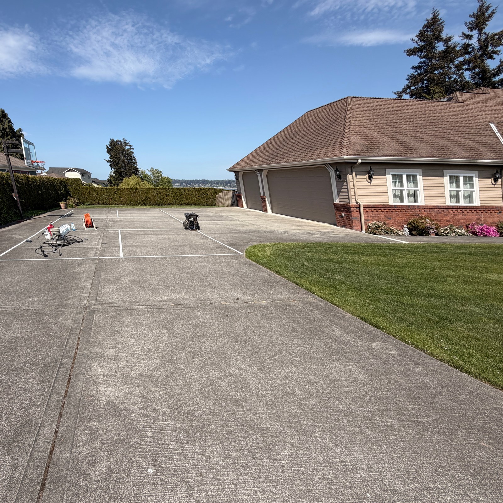 Before: long driveway pressure washing in Everett, WA
