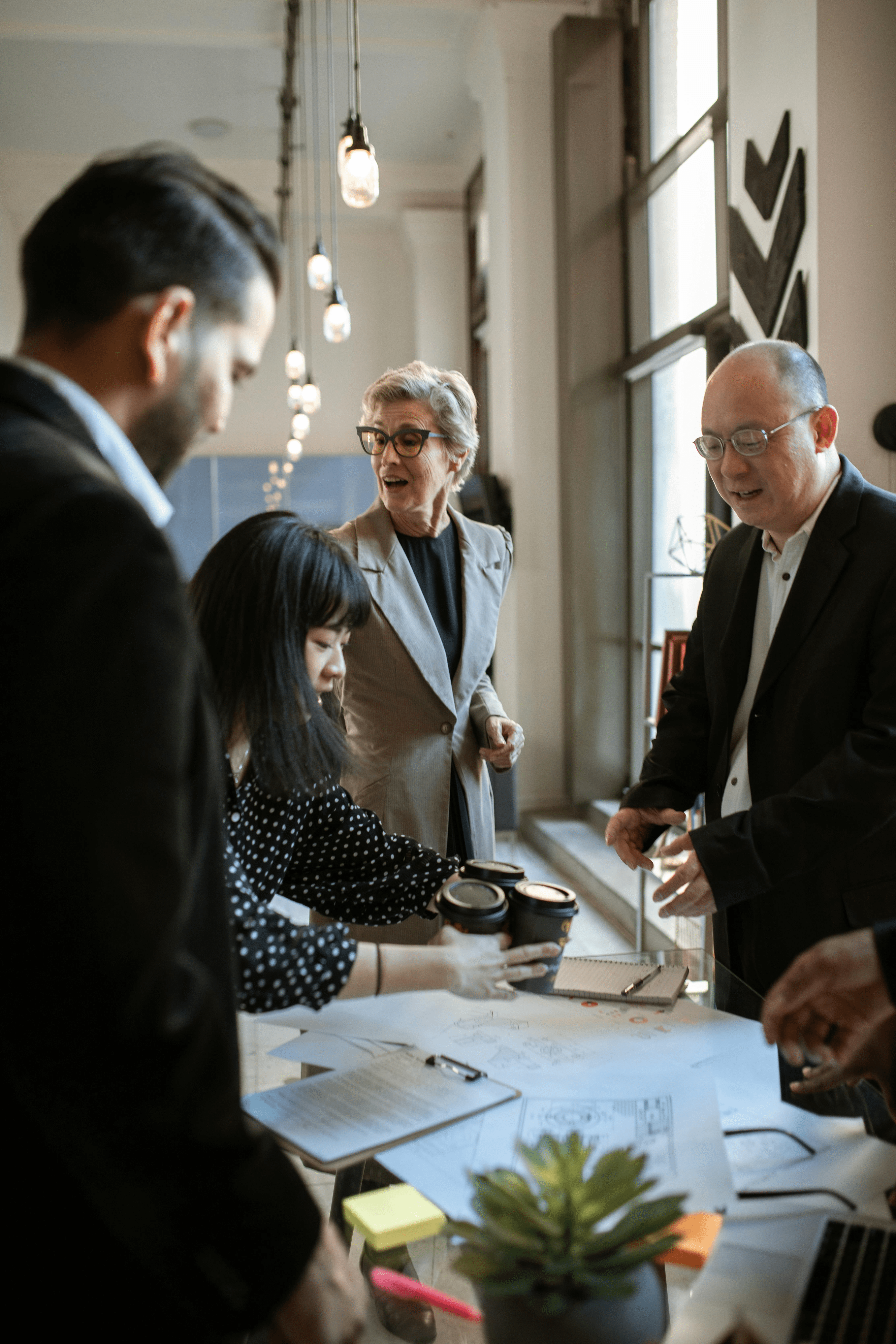 Photo by RDNE Stock project: https://www.pexels.com/photo/business-people-standing-together-having-a-coffee-break-5922322/