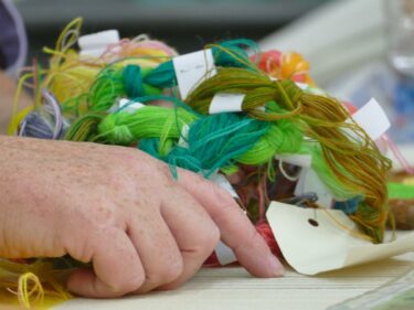 brown and white concrete house near green trees during daytime