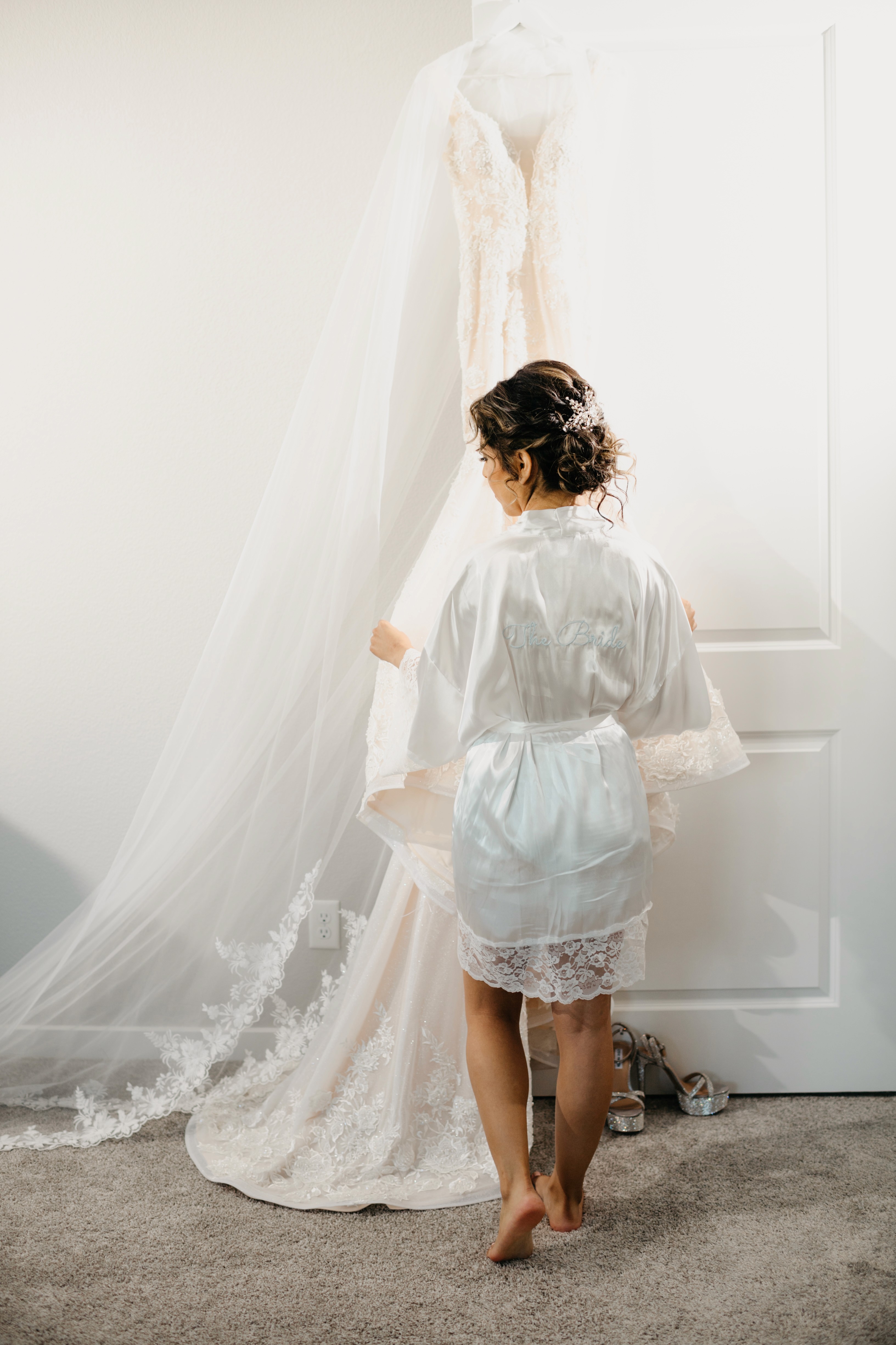 Bride looking at her dress before her wedding