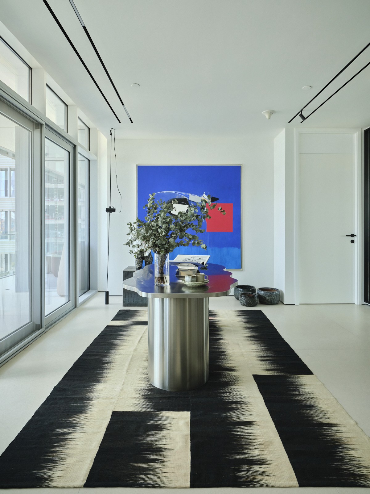 Minimalist interior with circular window detail and clean geometric proportions