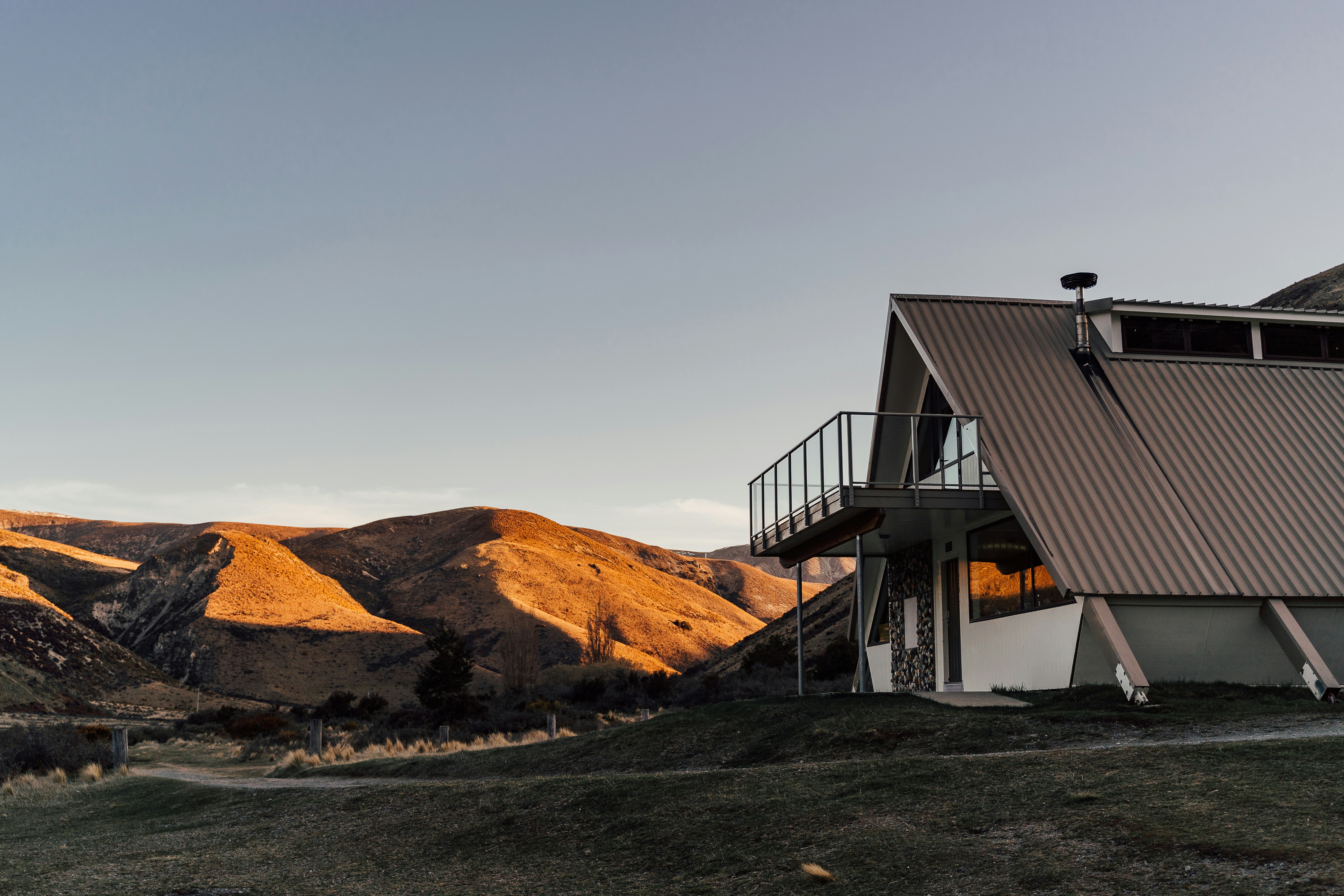 a building with a mountain in the background