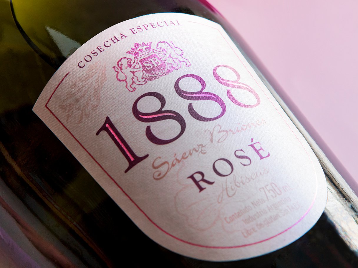 Rustic cabin in a golden field at sunset