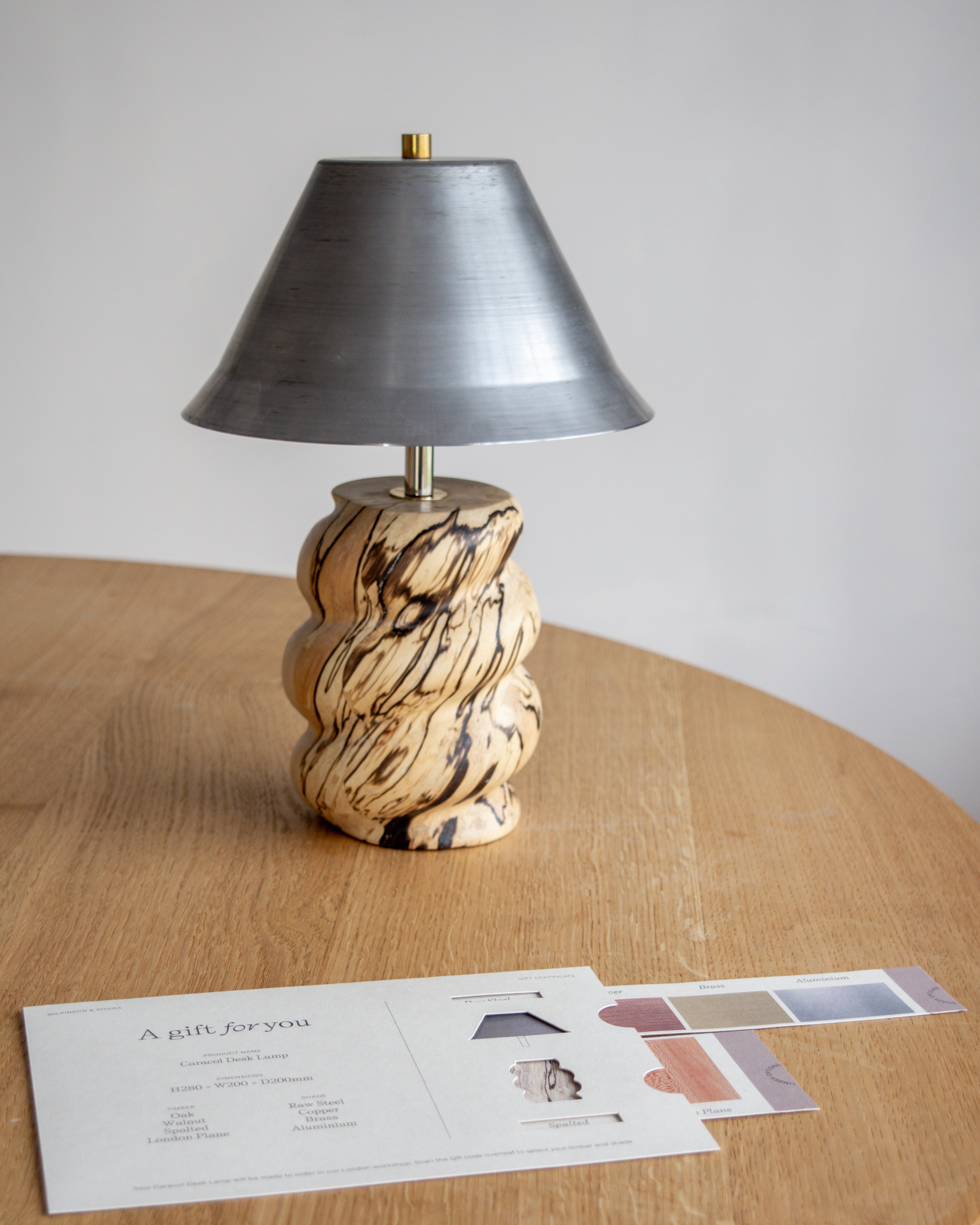 Caracol Desk Lamp in Hornbeam and Steel with Caracol Gift Card with Wilkinson & Rivera stamped envelope