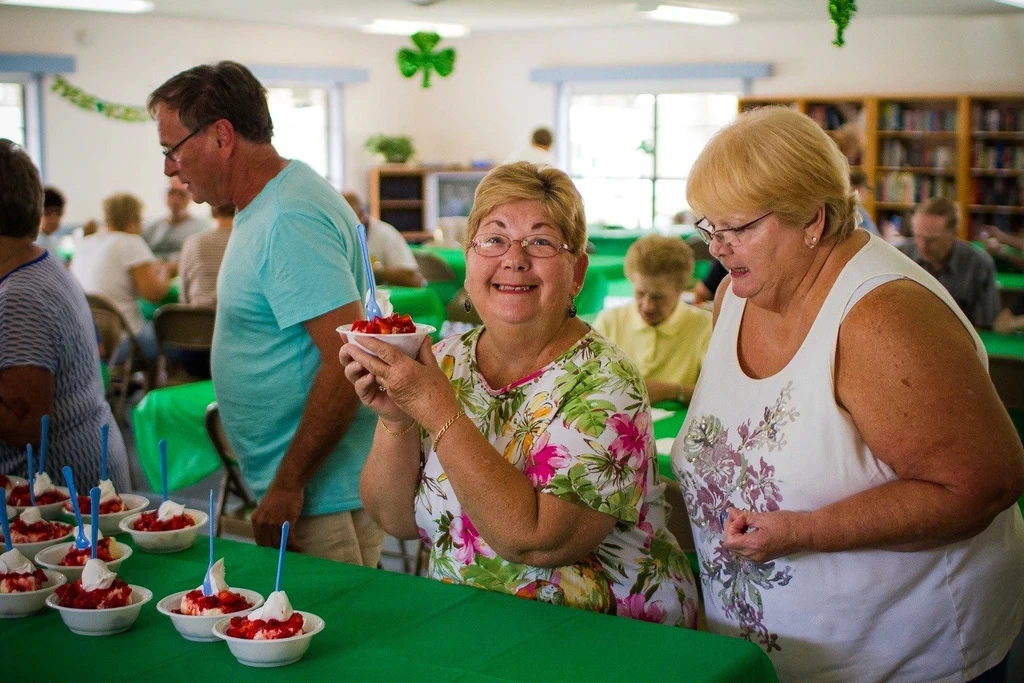residents eating strawberry shortcake