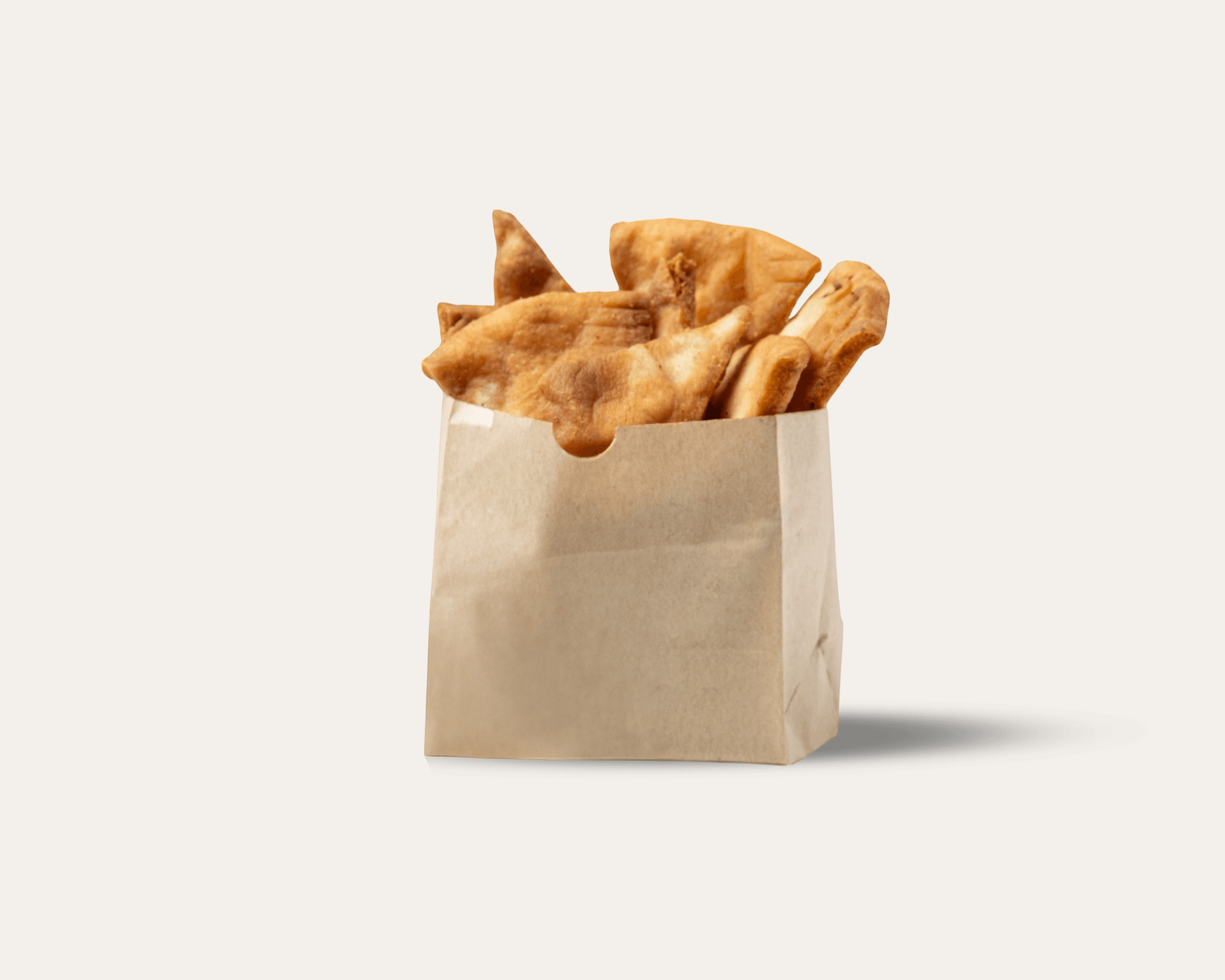 Pita chips in a small paper bag