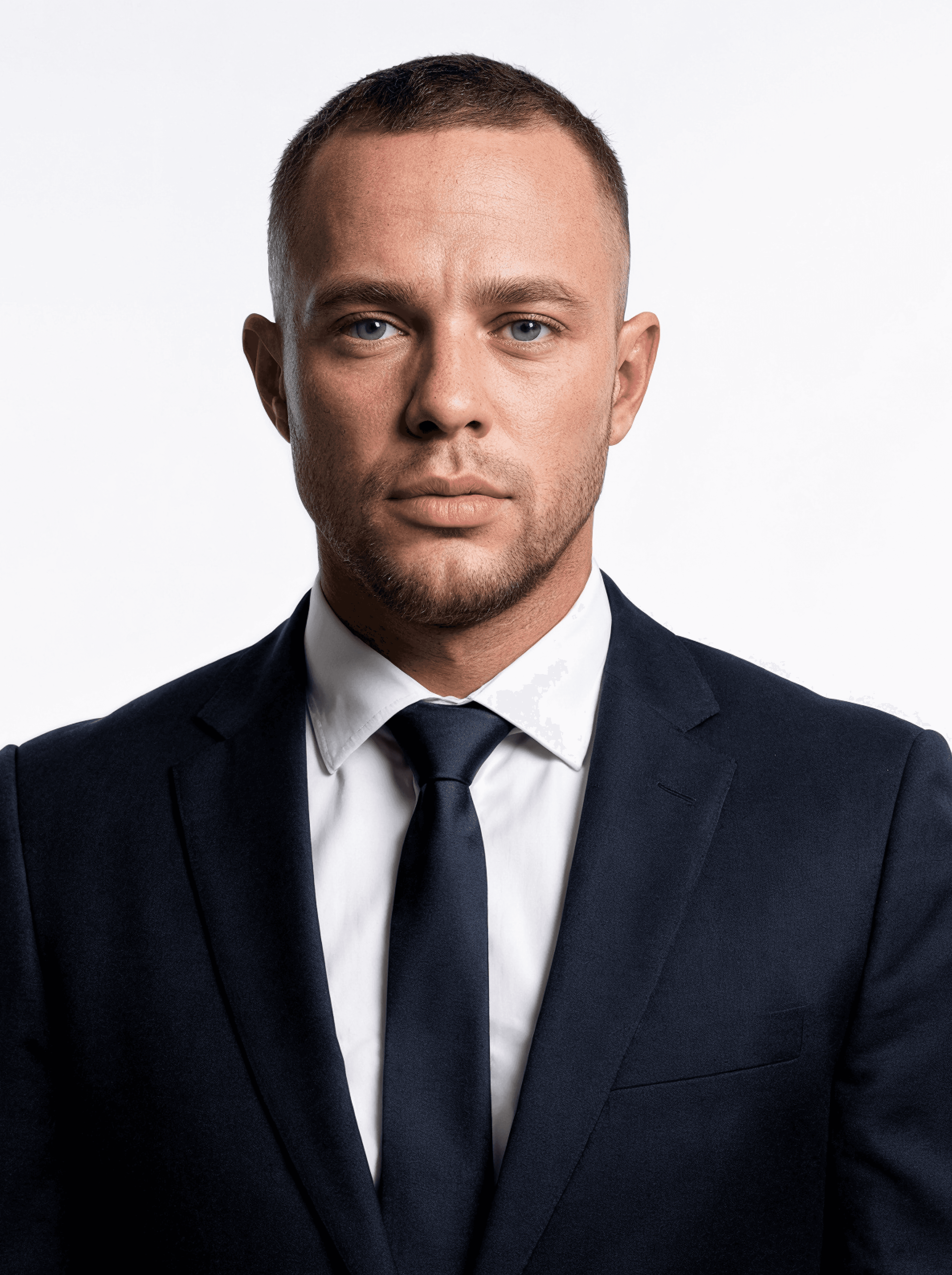 Portrait of a woman with straight long hair, in a dark t-shirt, set against a neutral backdrop.
