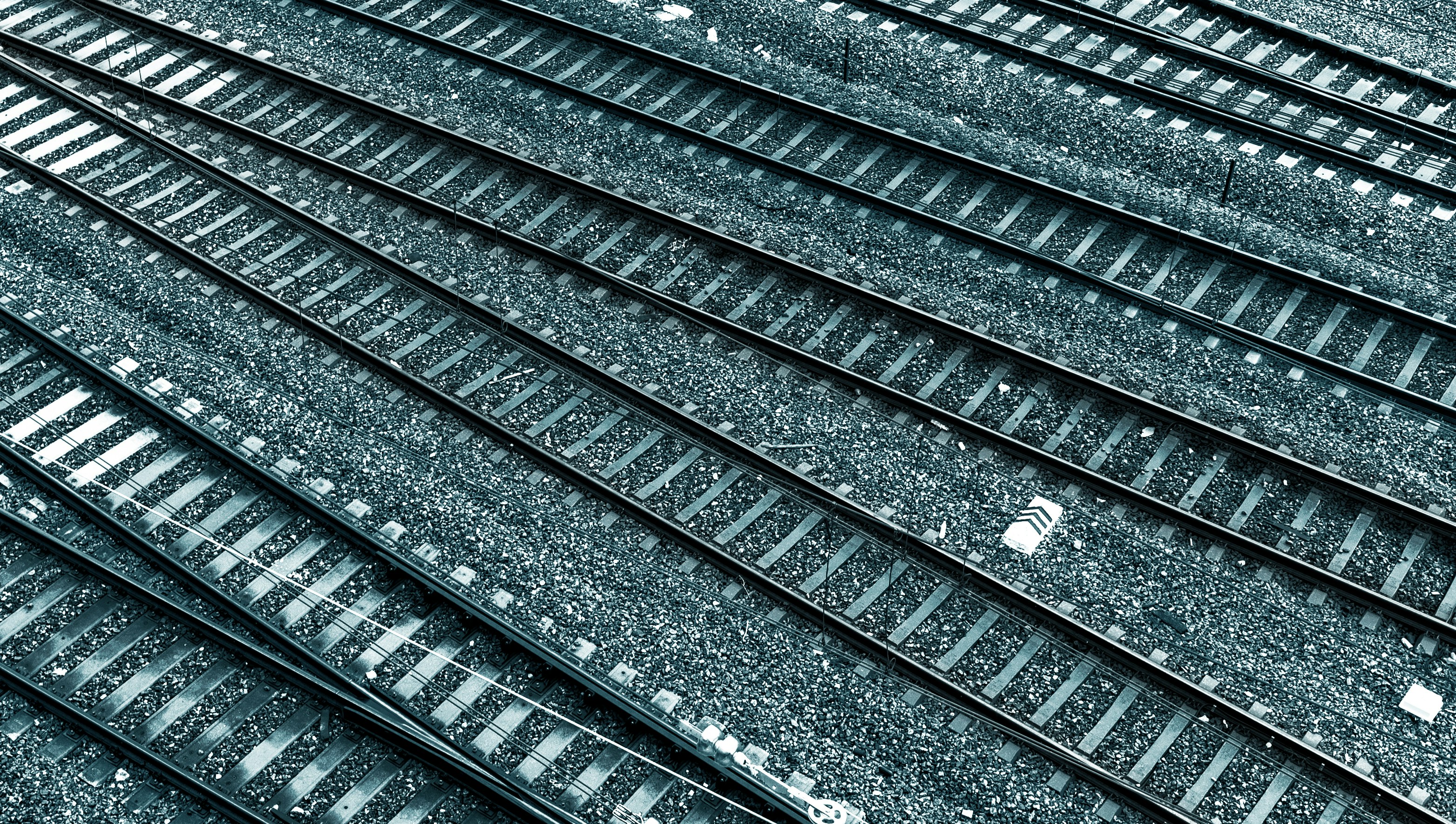 black metal train rail tracks