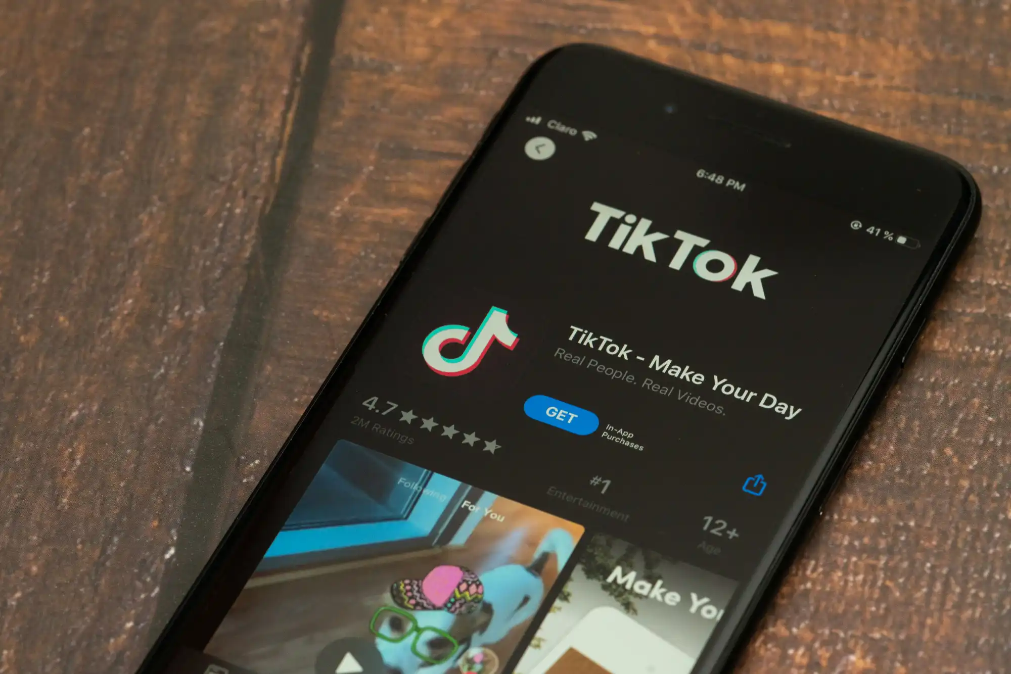A phone displaying the TikTok app, which is embedding new generative AI tools for its video creators.