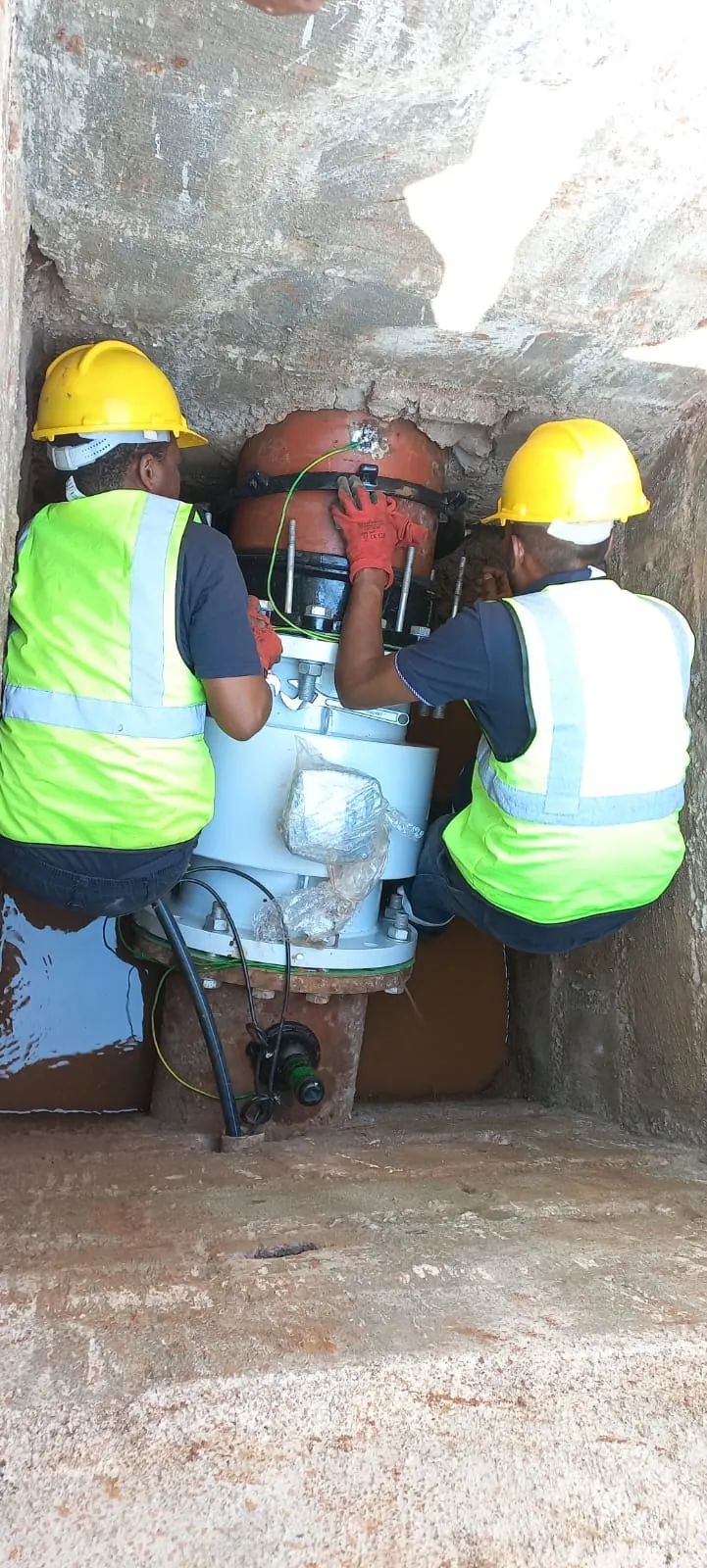JOAT technicians installing a valve inside a chamber