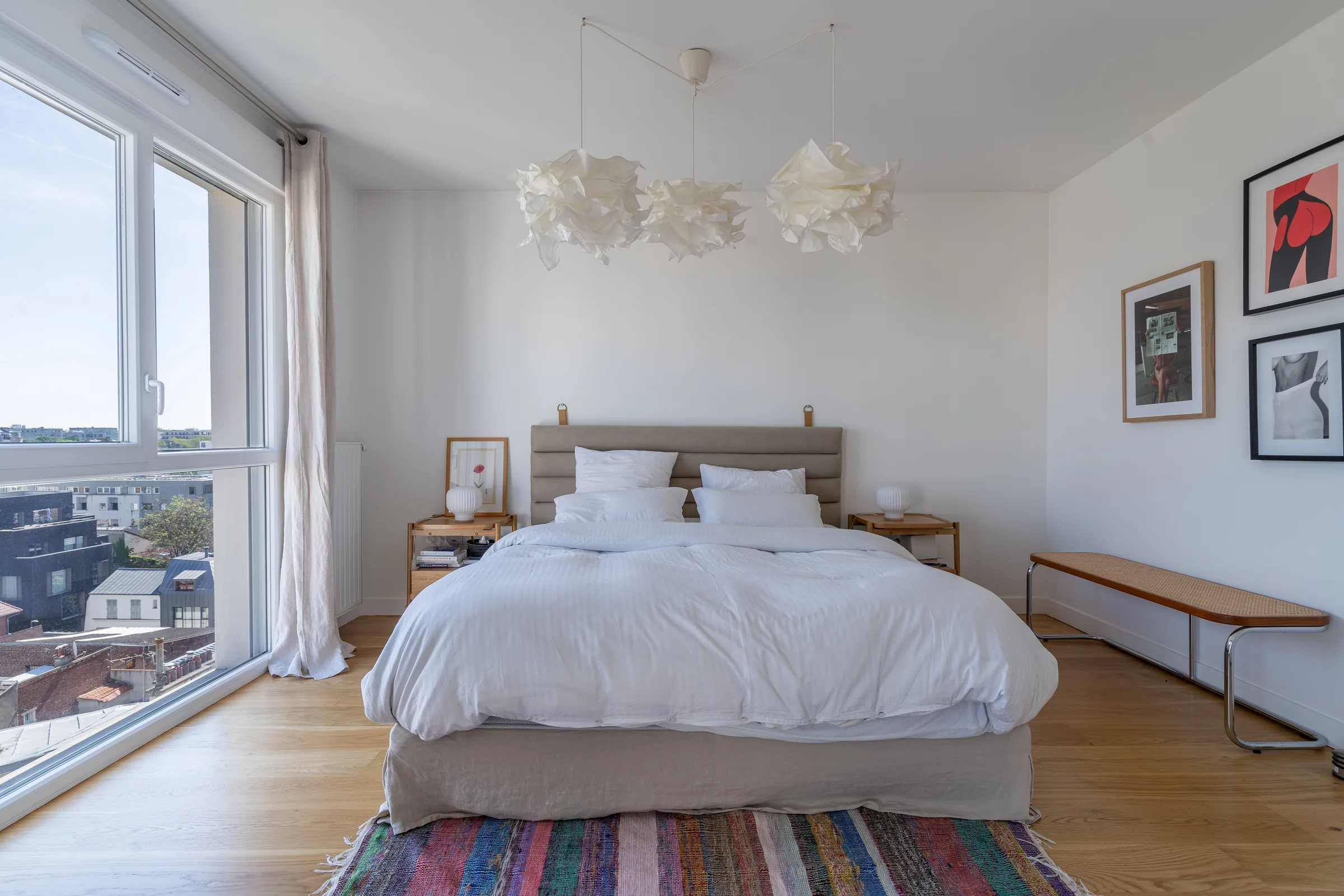 Bright white bedroom in Saint Ouen — Paris, France. Photography by Yunes Calore.