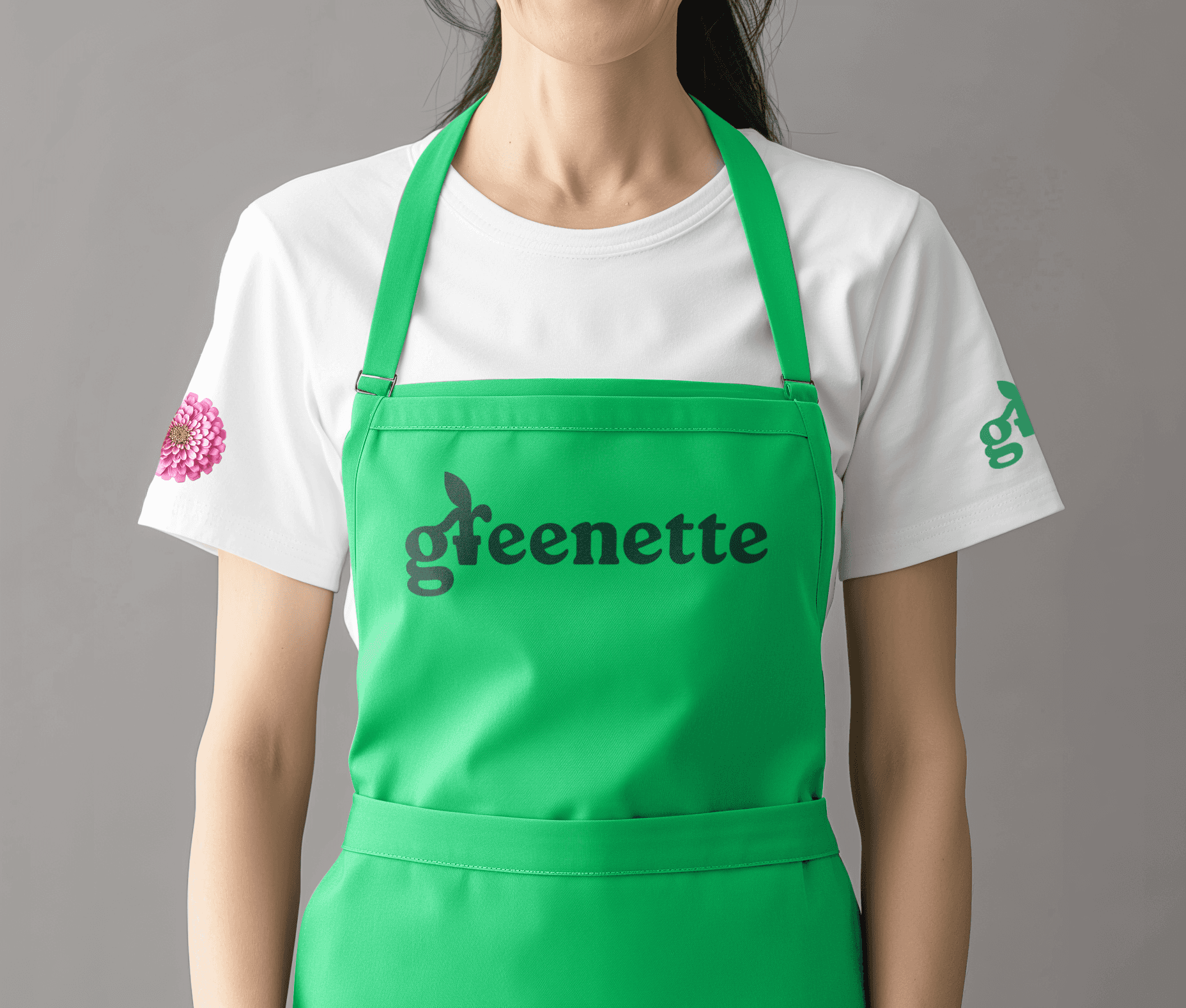 Staff member at garden centre wearing apron with logo