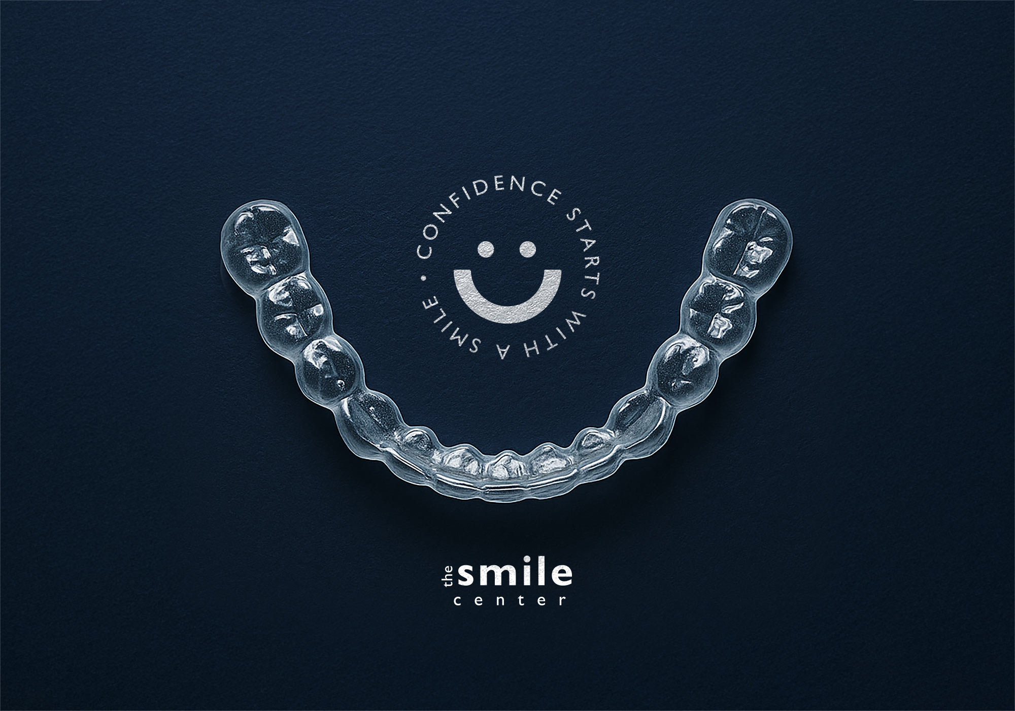 Teeth whitening tray on a blue background.