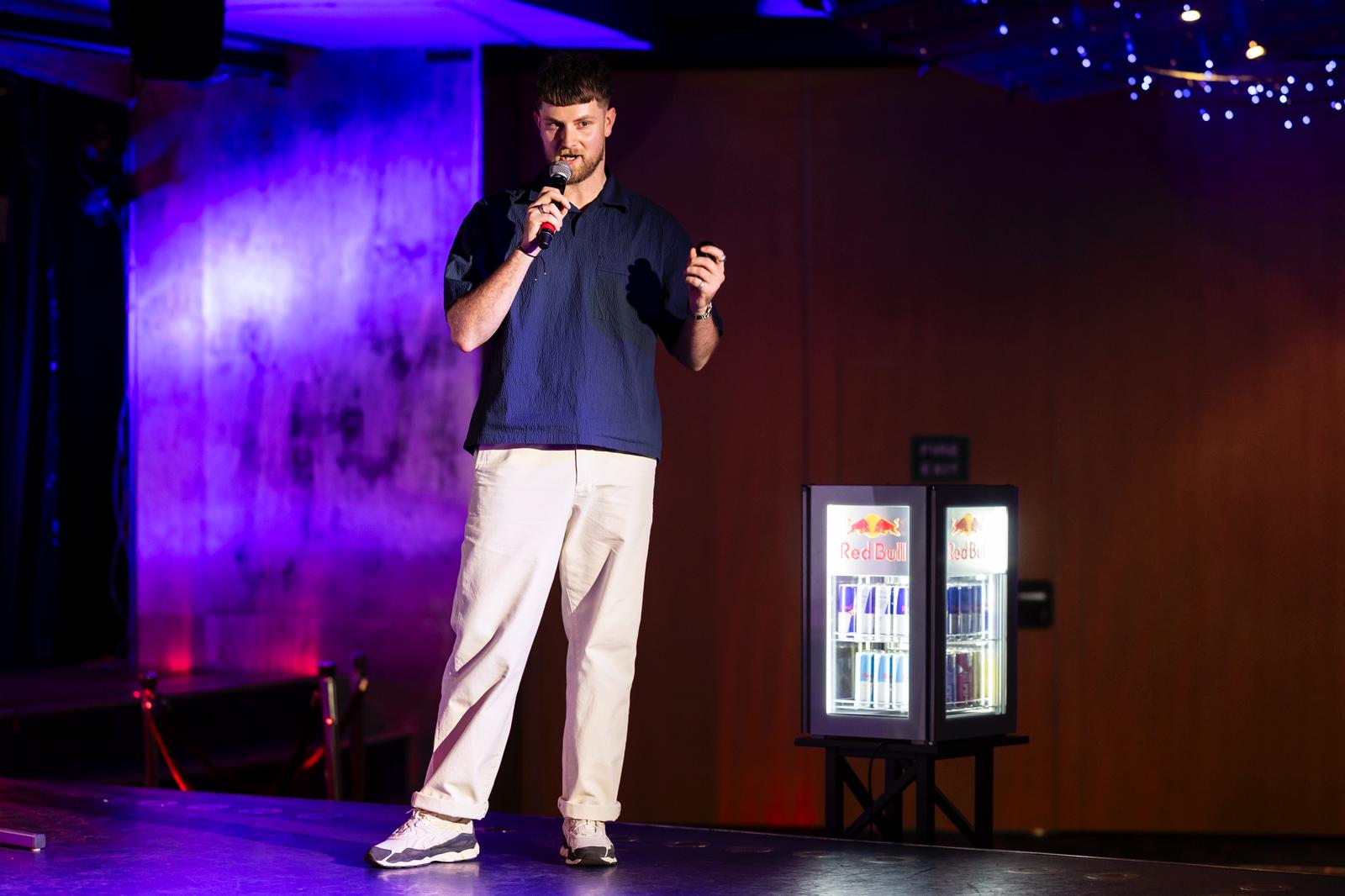 A fast black sports car races down the highway.