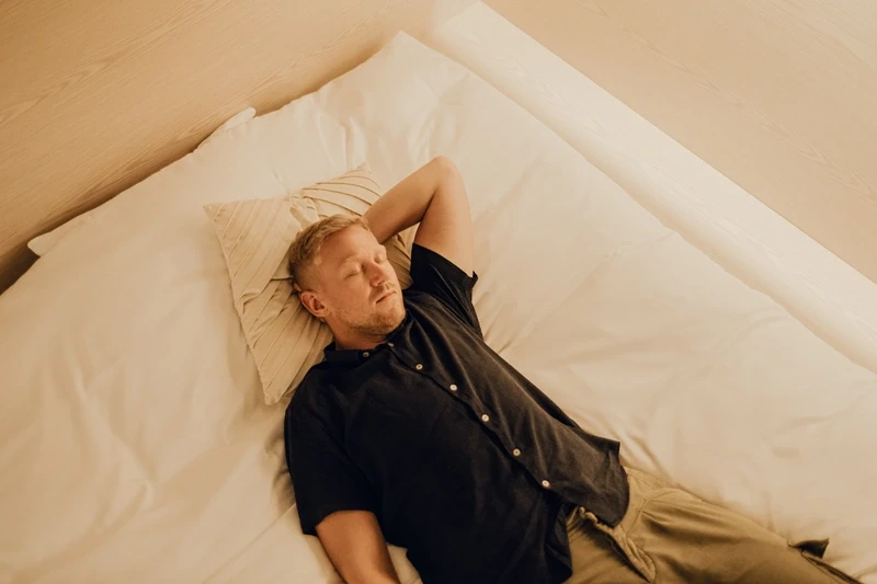 Man sleeping on bed