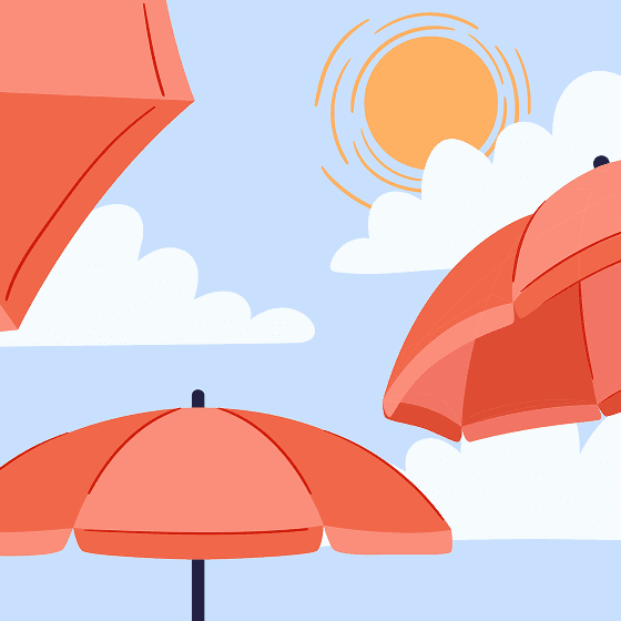 Red beach umbrellas under a bright sun