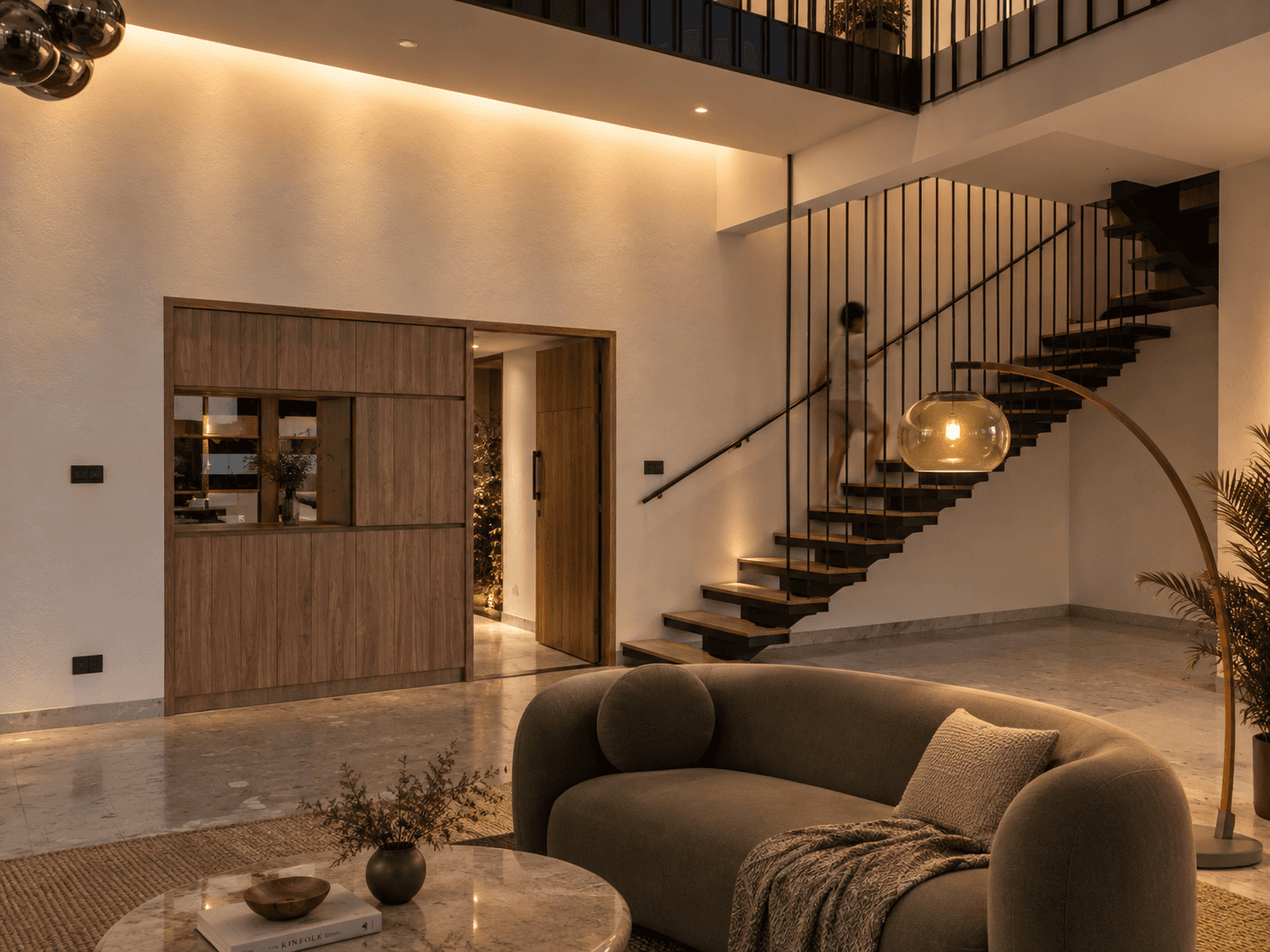Focused pools of warm light create intimate places within the larger civic space.