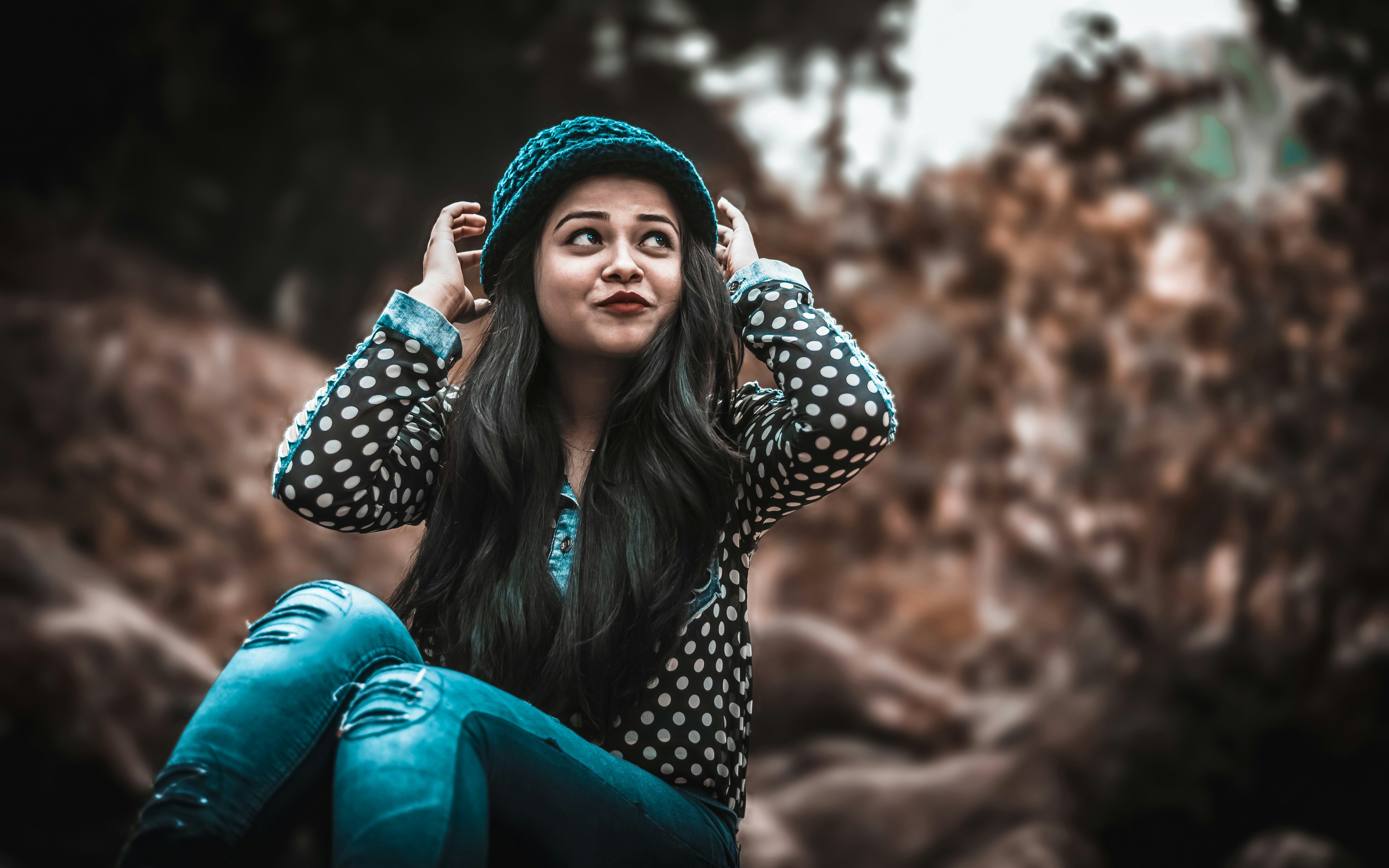 woman adjusting her cap - Neutral Skin Tone Colors To Wear