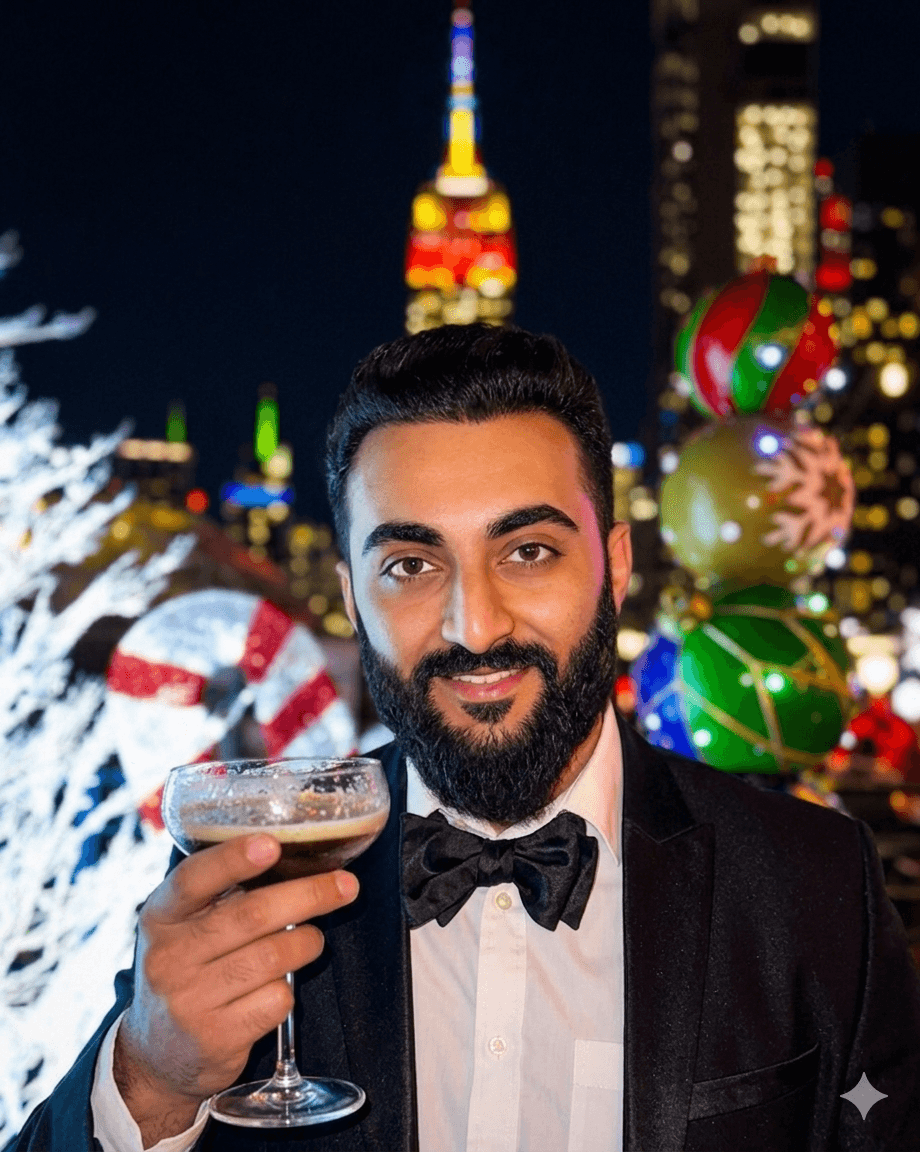 A thoughtful young person with dark hair gazes to the side, captured in soft black and white lighting.