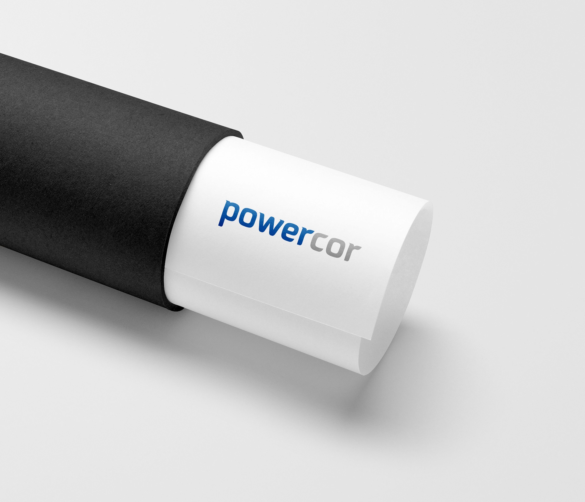 Powercor logo brand design on paper in postage tube