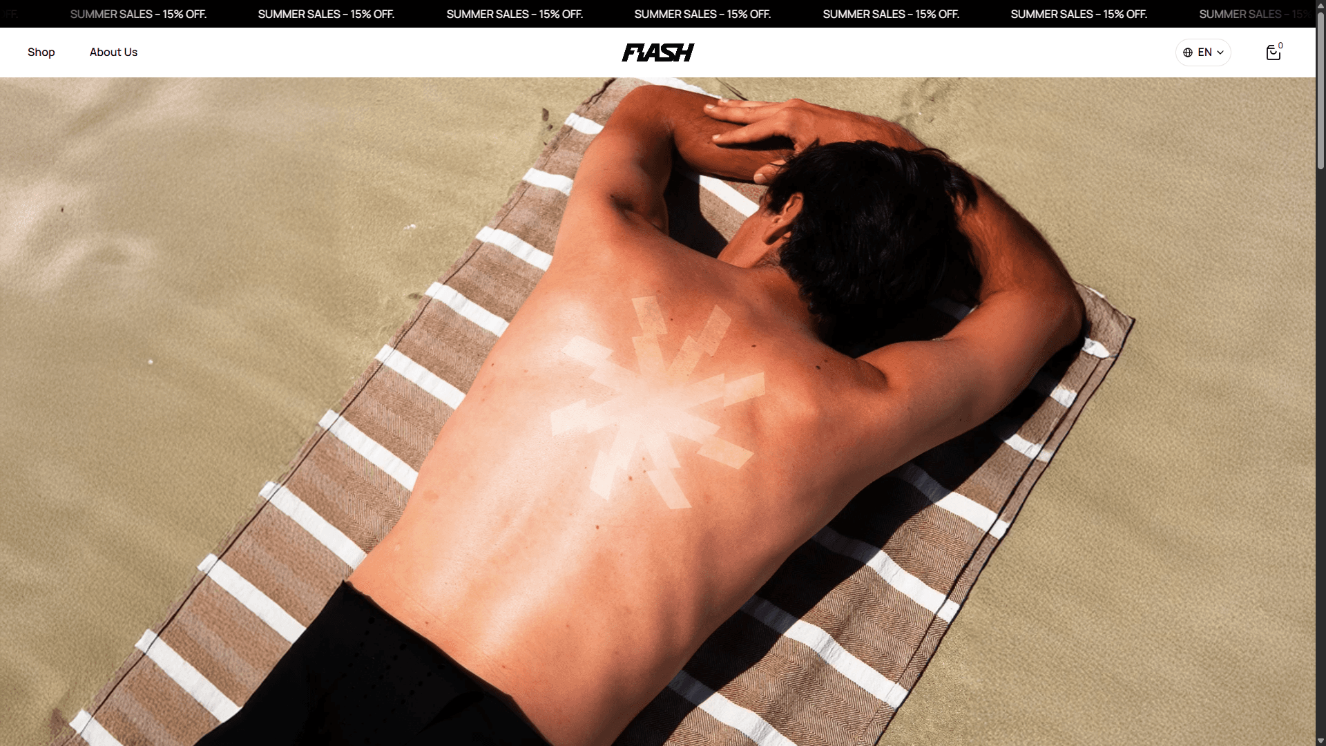 Man lying face down on a striped beach towel, with a geometric tan-line pattern on his back created by sun exposure.