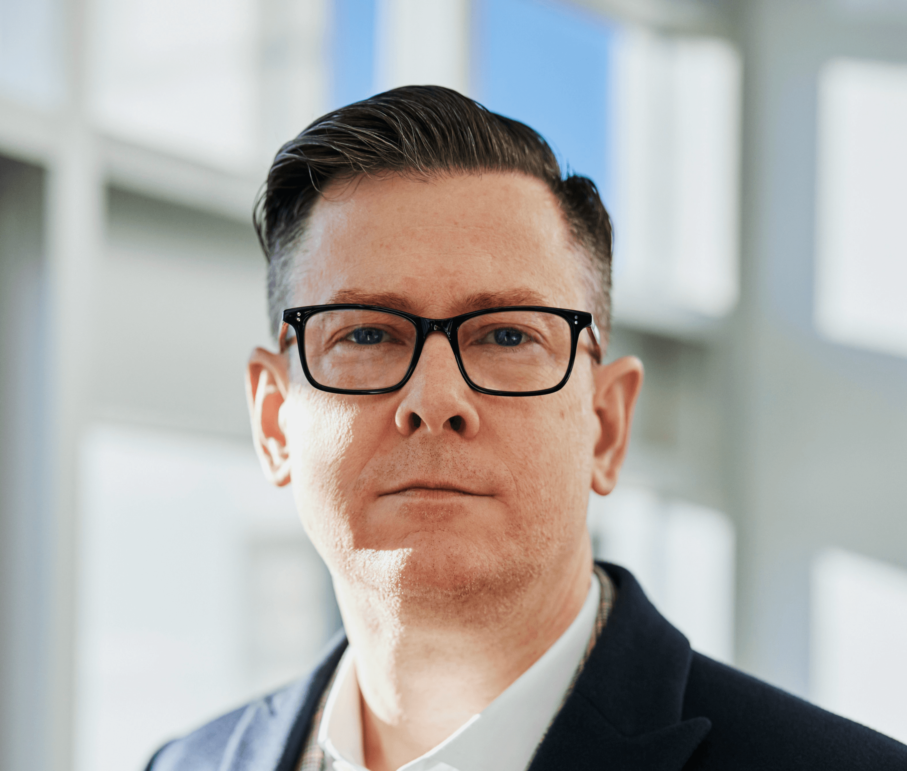 man standing beside wall