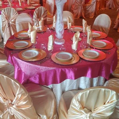 A waitress is serving food at a buffet.