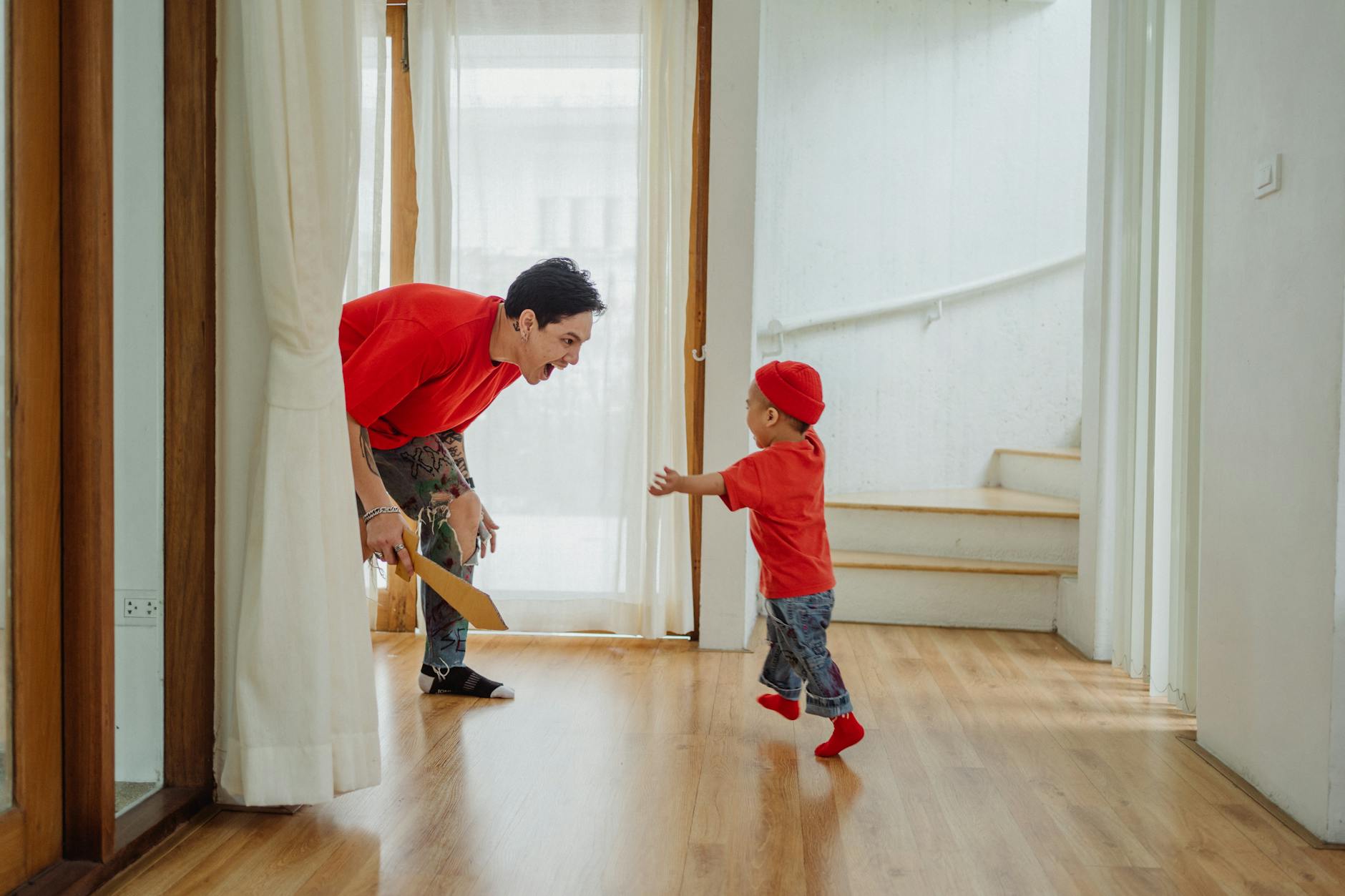 A mother and son counting out apple slices onto plates during a healthy afternoon snack time.