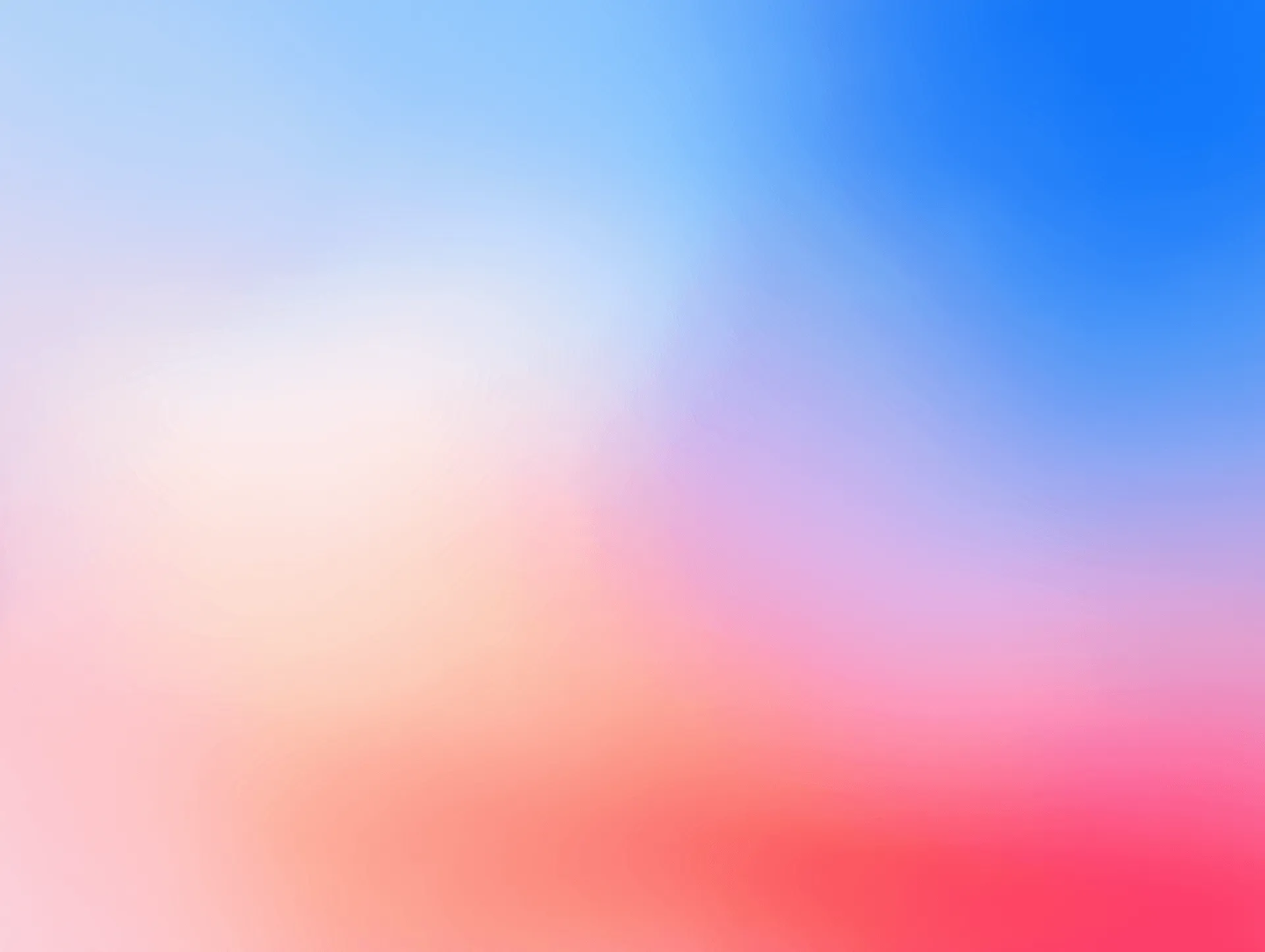 Soft gradient of blue, pink, orange, and red hues.