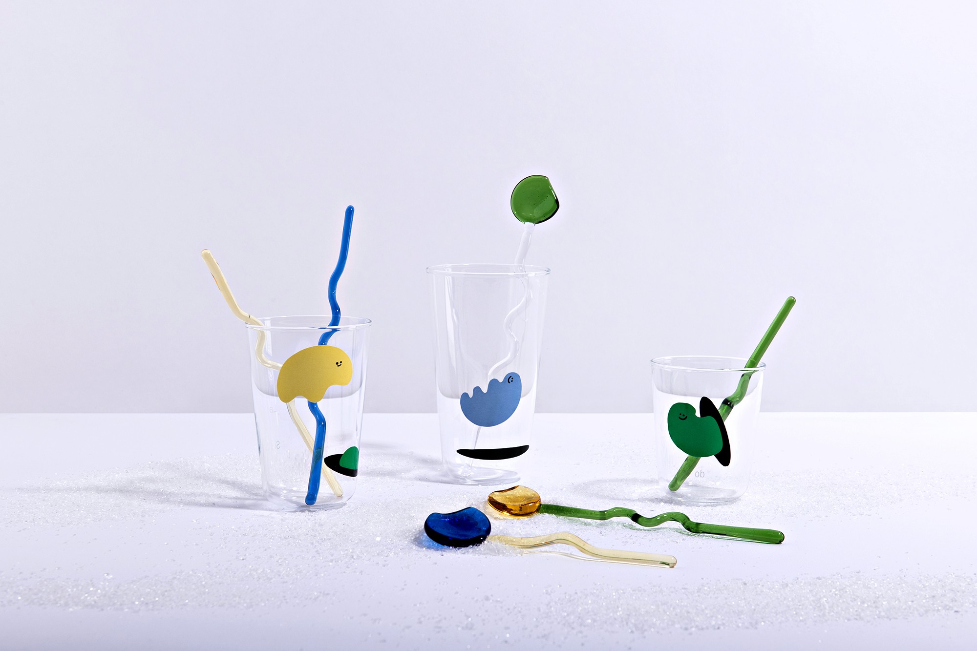 Glass cups and colorful glassstir sticks