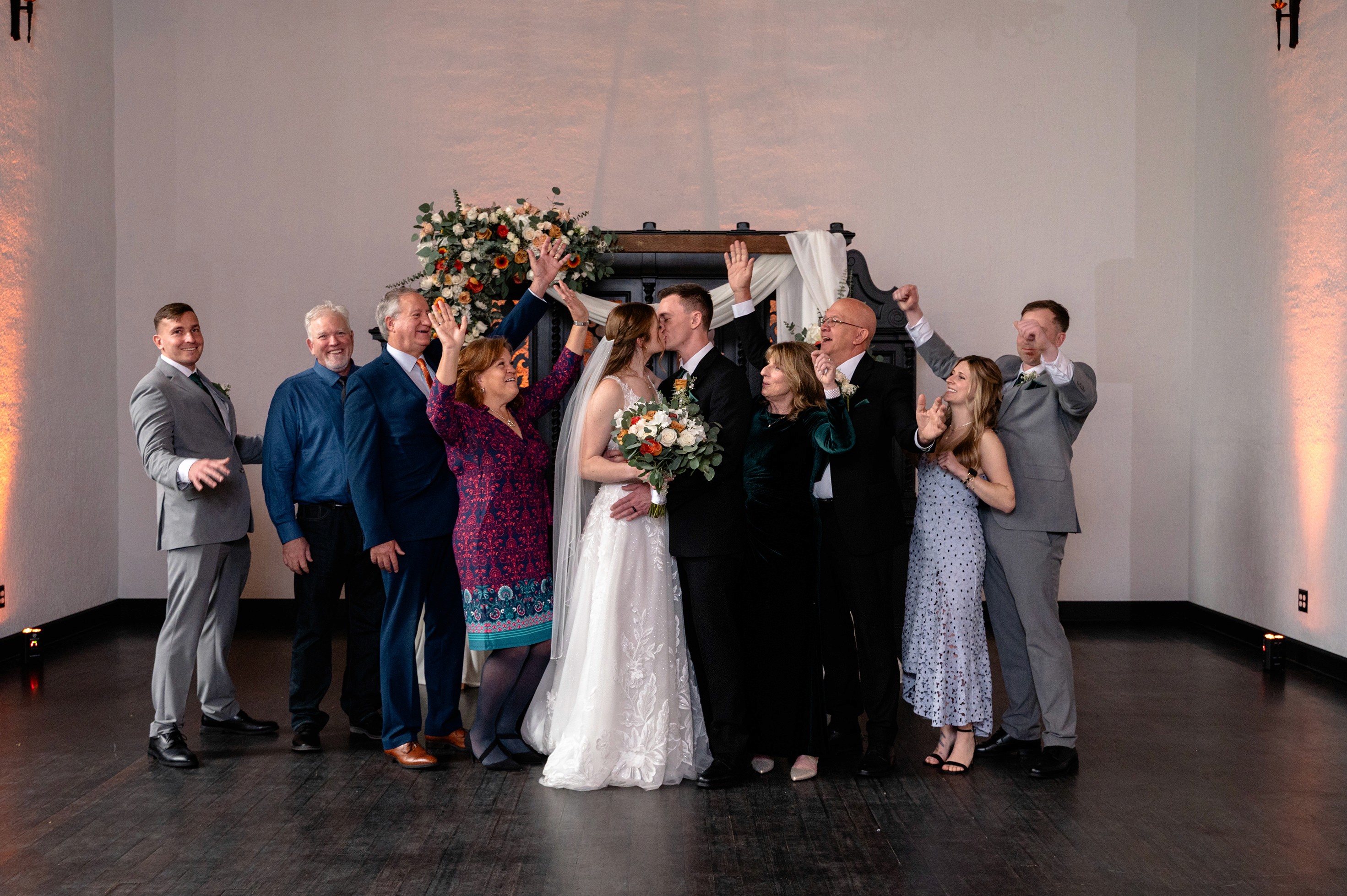 Flat lay wedding details with bouquet, rings, and sparkling bridal heels