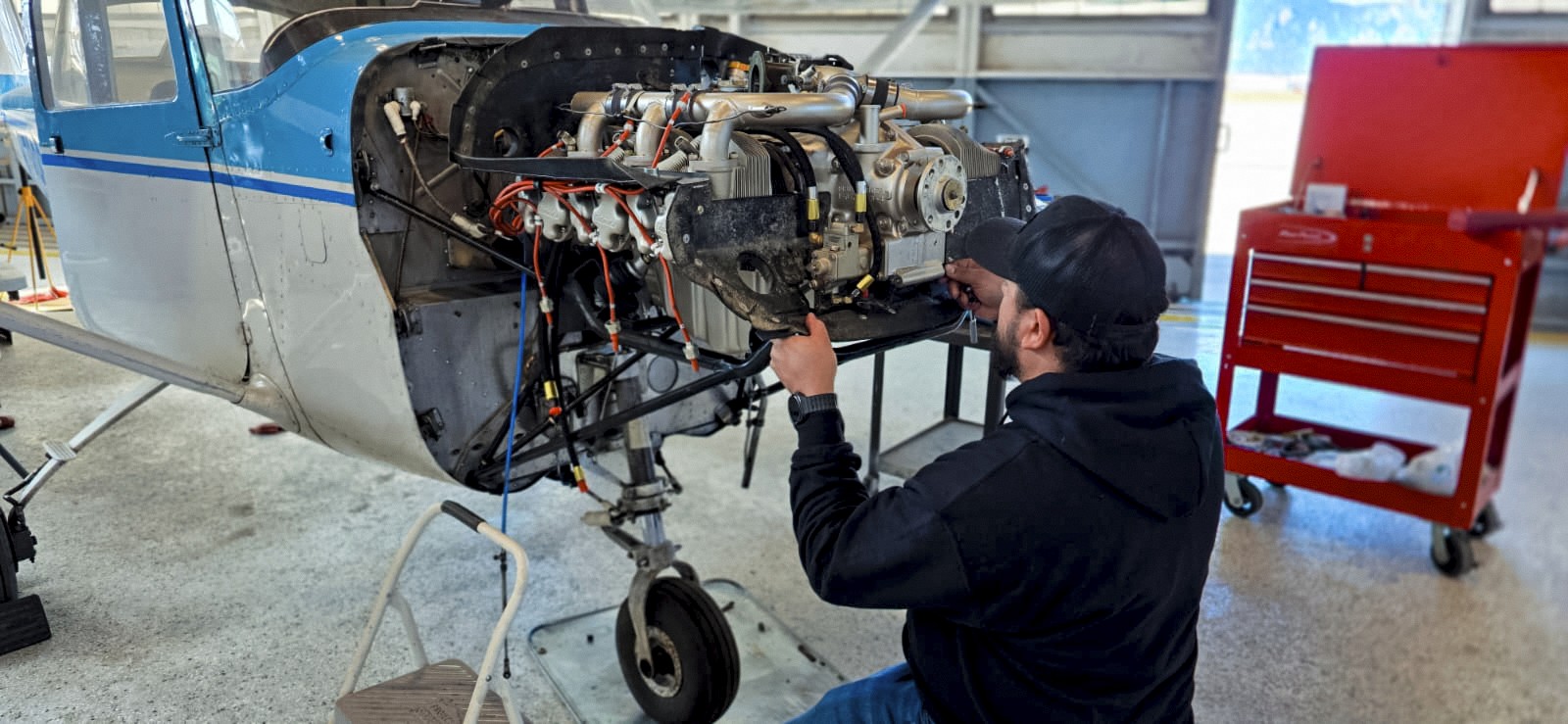 jose working on an airplane engine