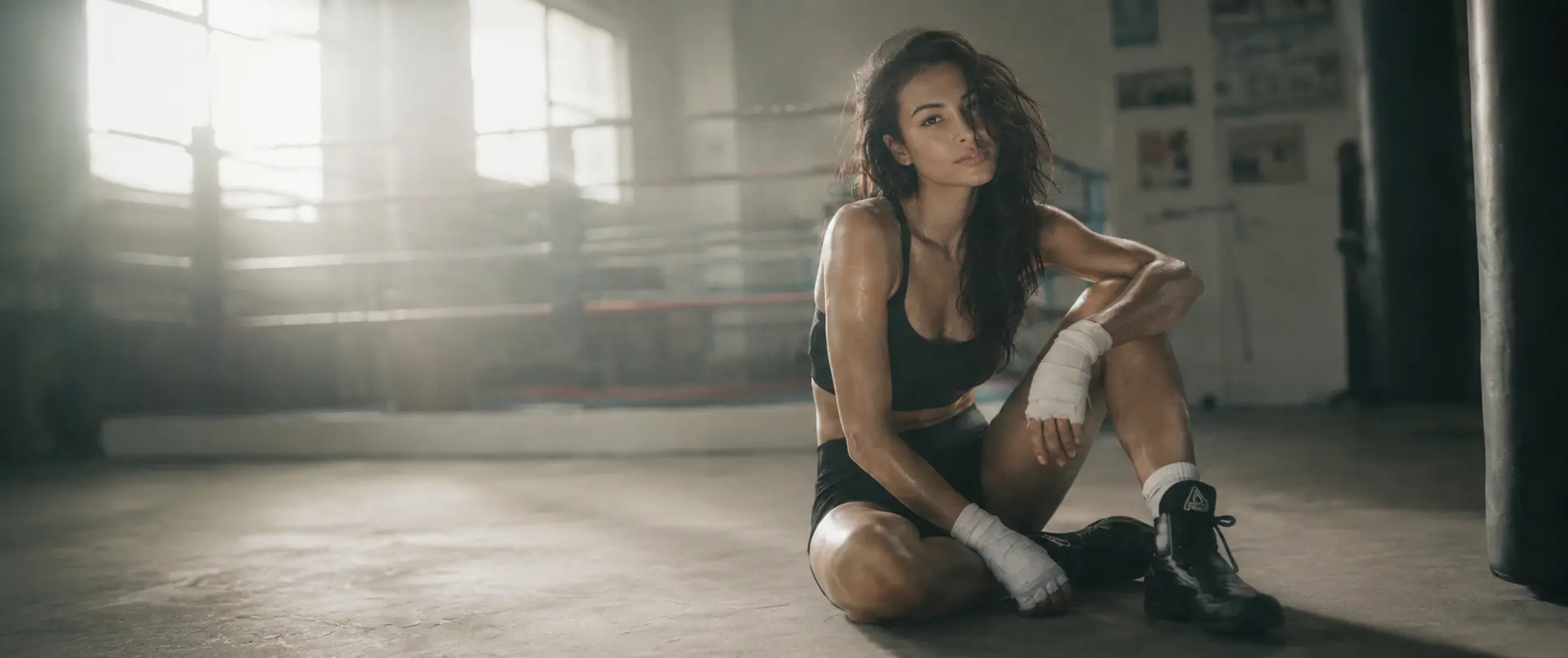 Female Boxer standing in a boxing gym