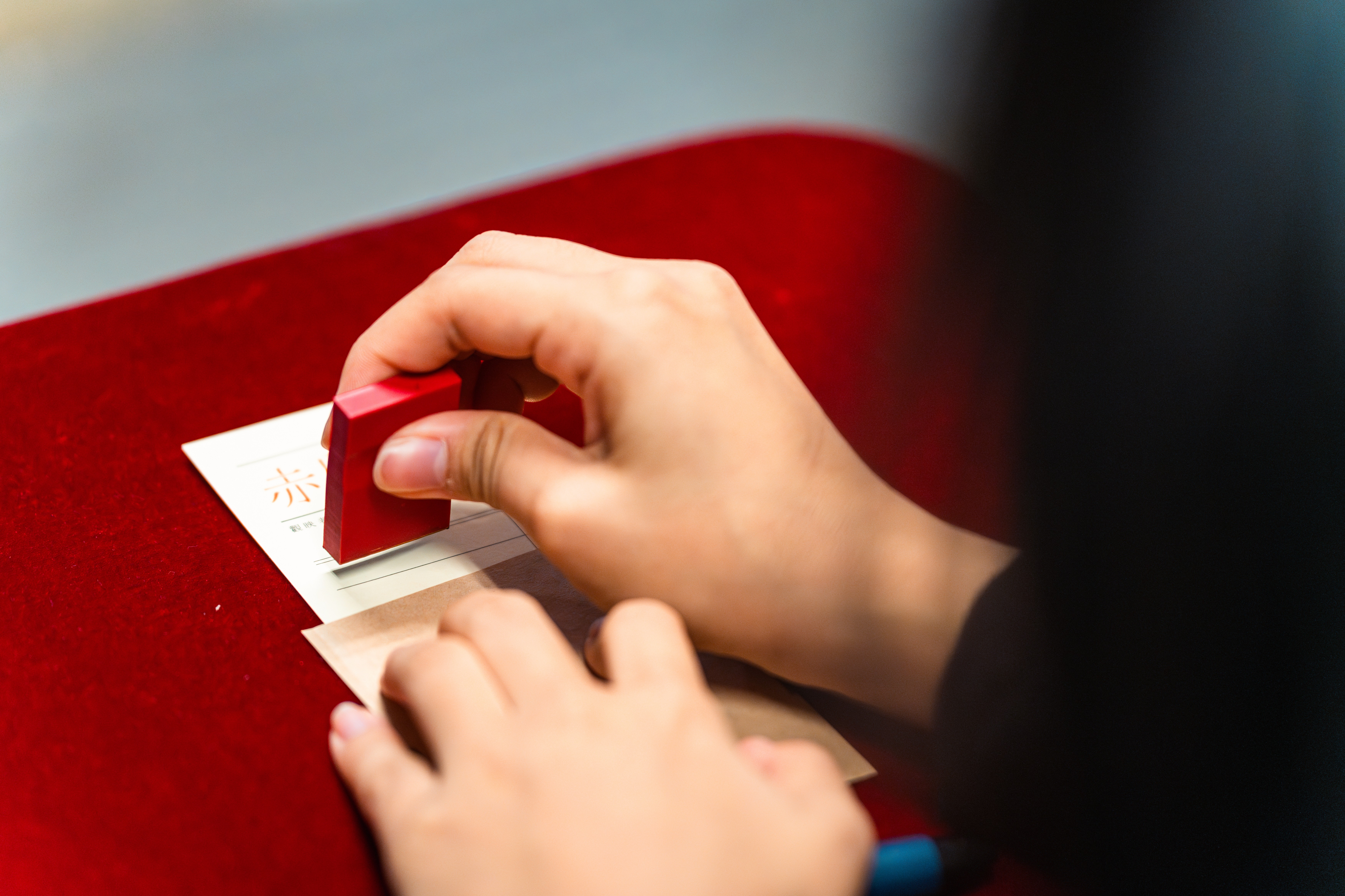 crewmembers are working on the merch with different film sections