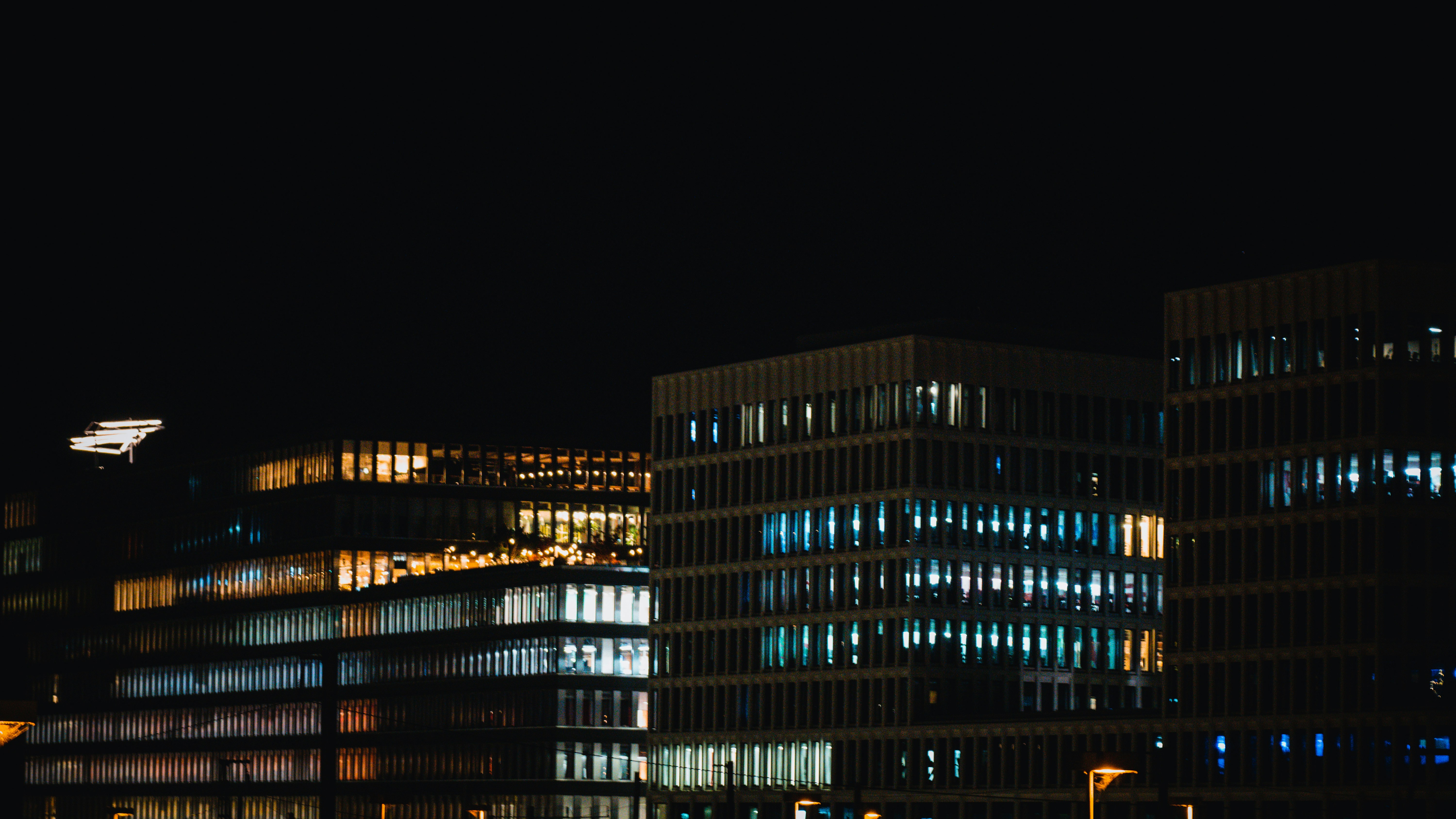 a group of buildings with lights on at night