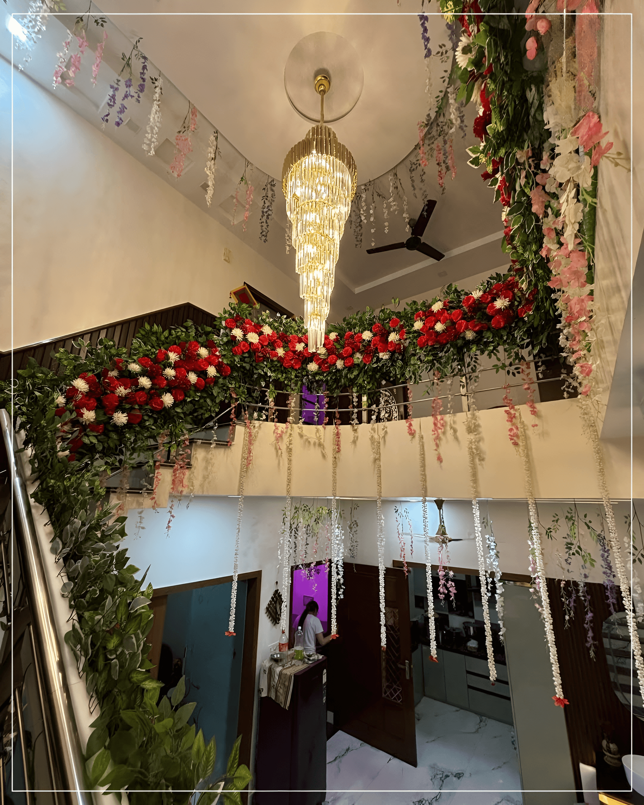 Stair railing decor with red & white flowers for indoor wedding decoration in Malviya Nagar, Rohini, Ashok Vihar, Delhi NCR.