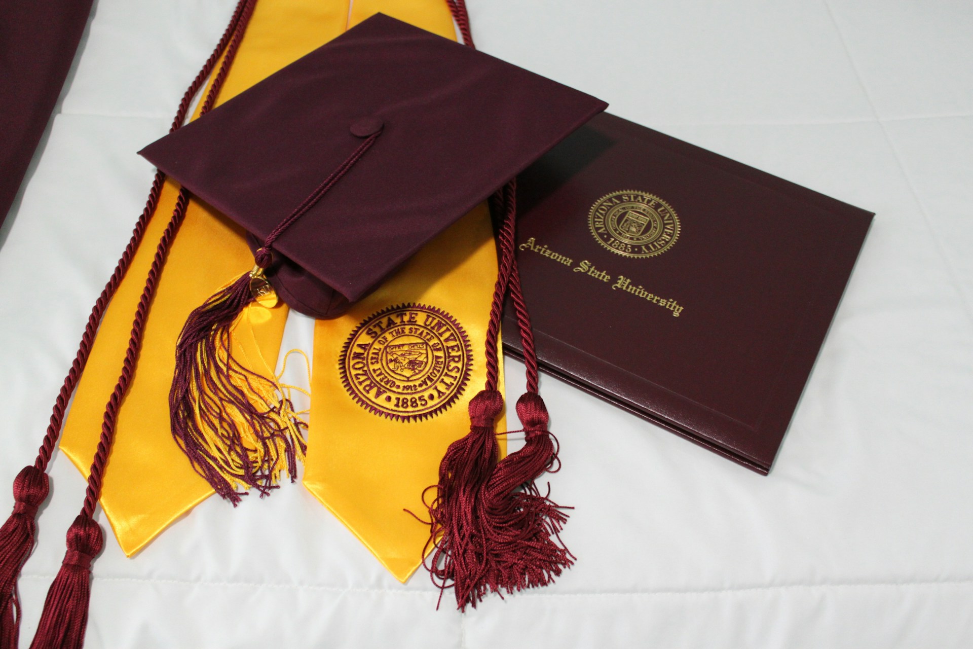 Graduation cap and diploma from Arizona State University representing Master's in Clinical Psychology