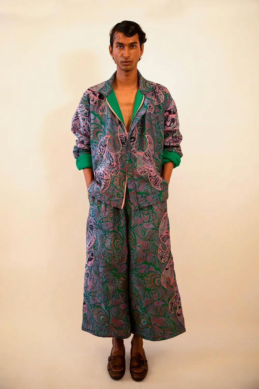 Our one-of-a-kind unisex dragon patchwork bomber and wide pant set is handcrafted by skilled artisans in-house using vintage textiles. 