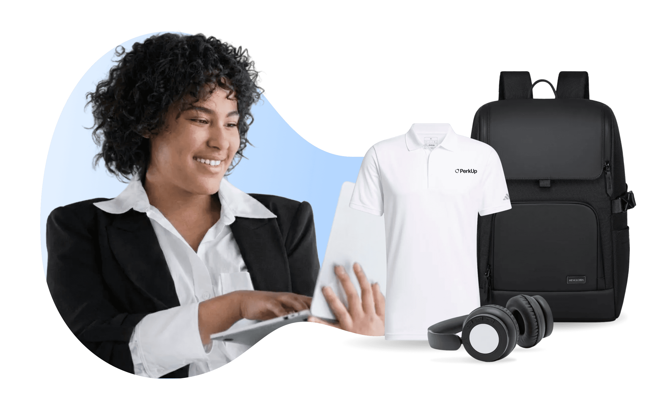 A woman smiling at a laptop. Beside her, there is a polo shirt, a backpack, and headphones.