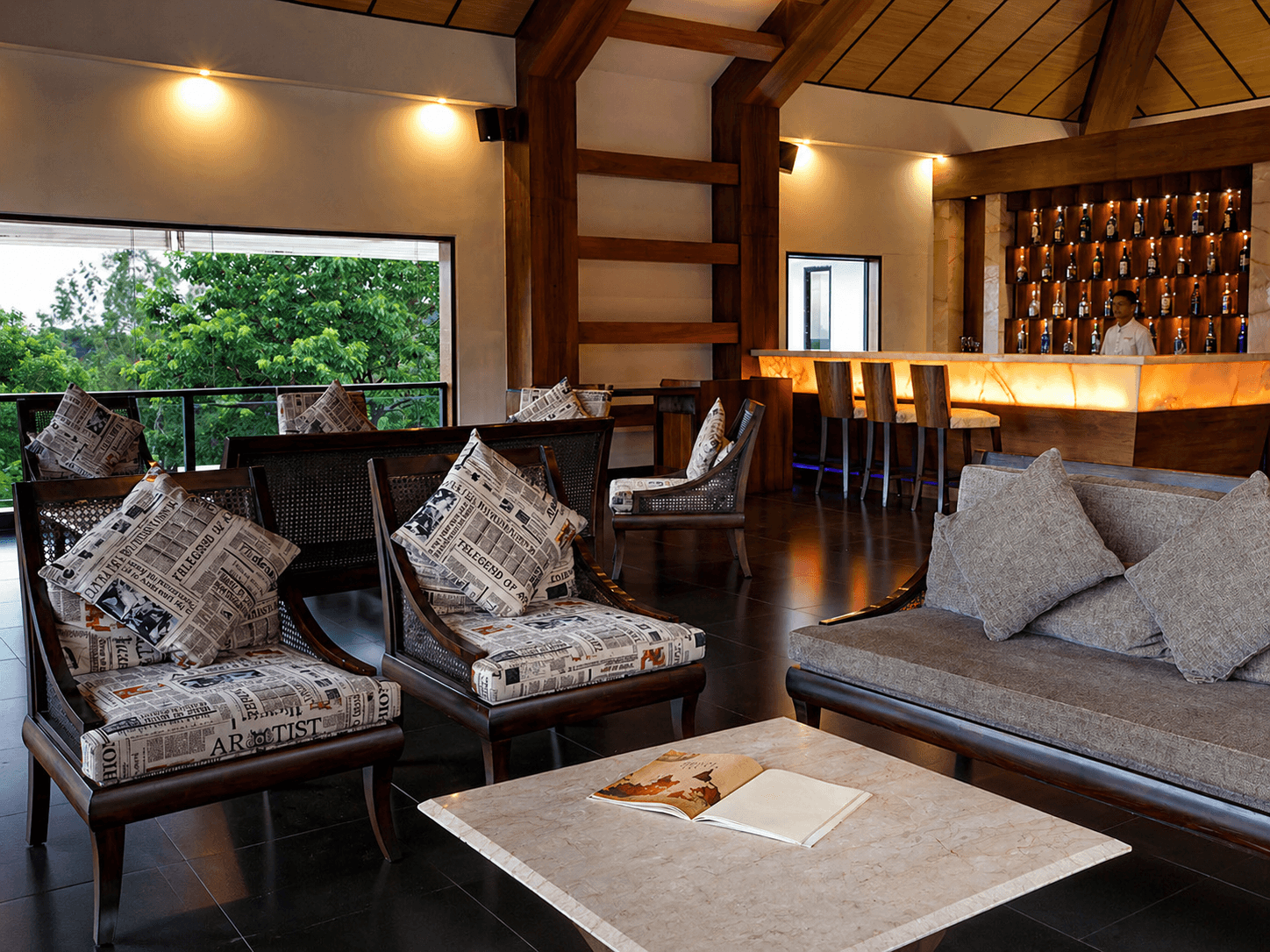 Modern living room with orange chair and plant.