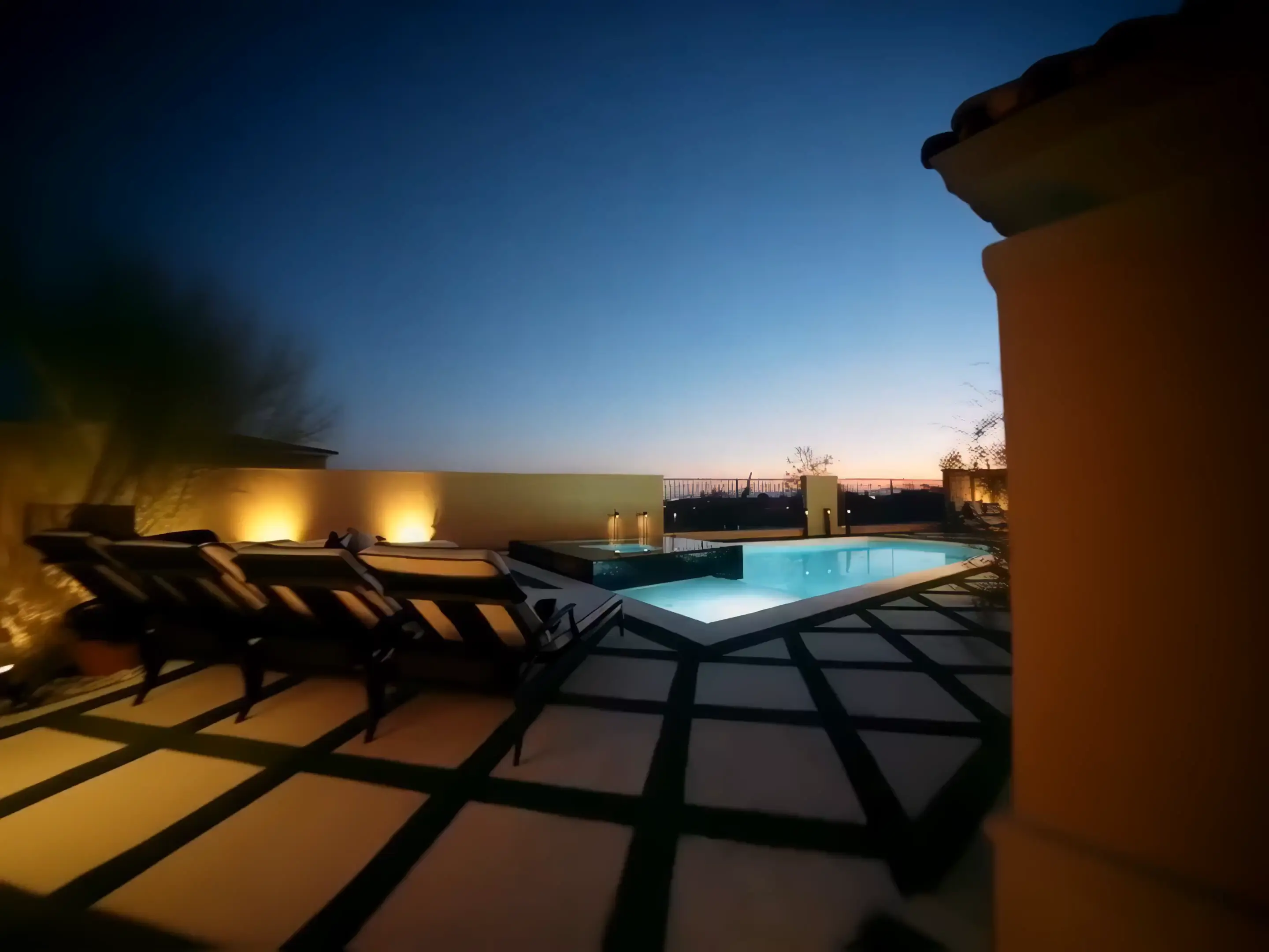 Custom Arizona backyard with pavers, turf and outdoor lighting by Country View Hardscapes
