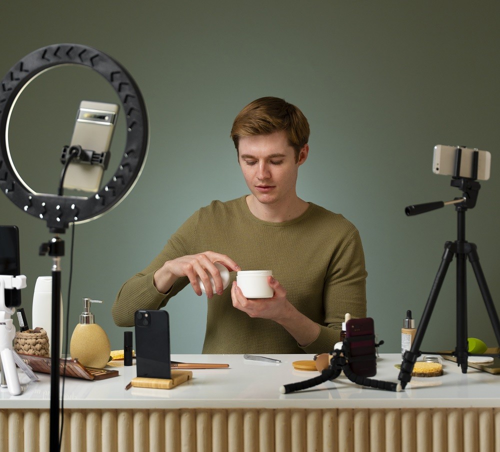 Content creator filming skincare product routine for TikTok Shop bundle promotion using influencer marketing to drive ecommerce sales.