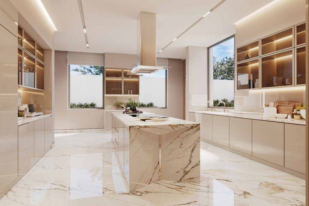 A modern South Bay kitchen featuring marble countertops and a spacious island for cooking and entertaining.