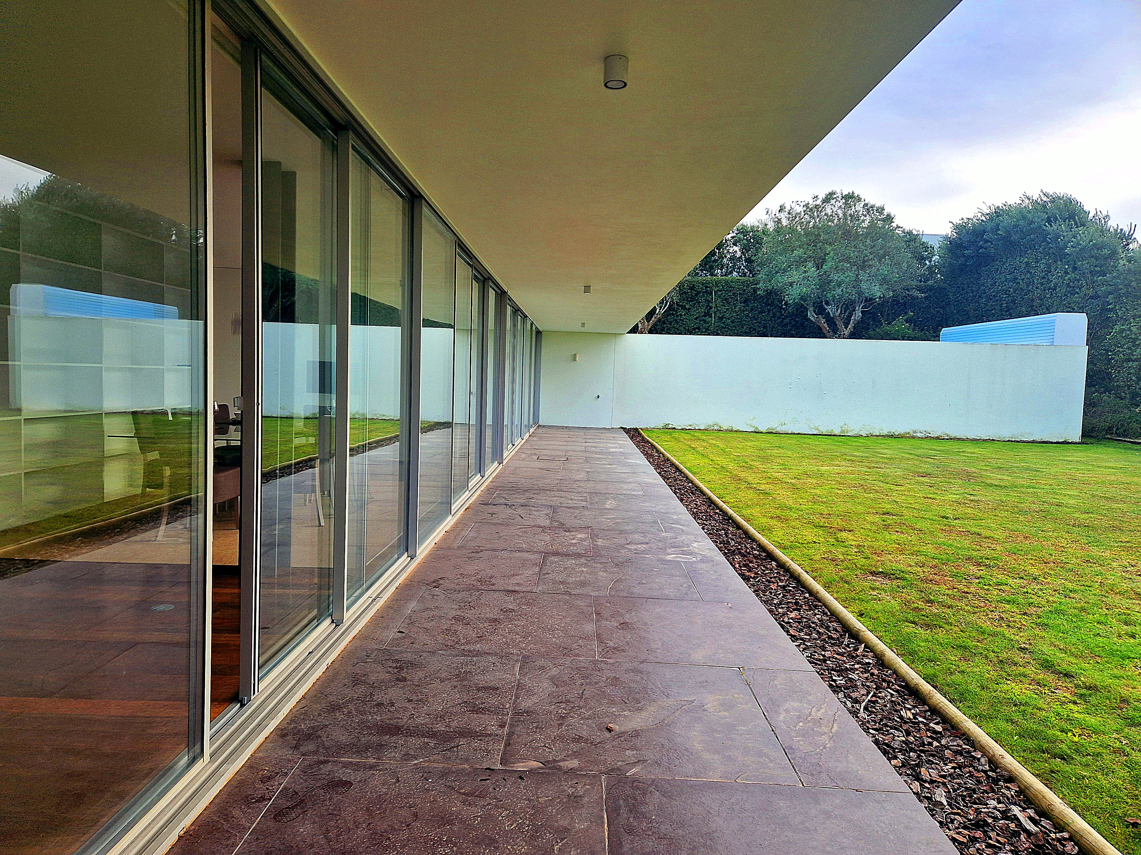 Modern balcony with mountain view and lounge chairs