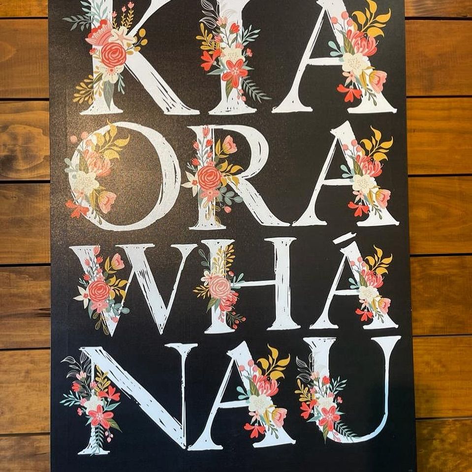 A man holding a cocktail in a dimly lit bar