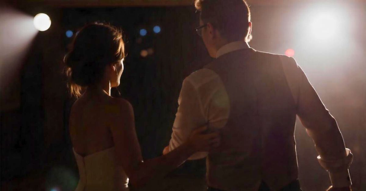 Bride and groom dancing together.