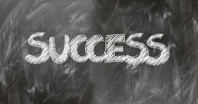 Chalkboard with the word success on it