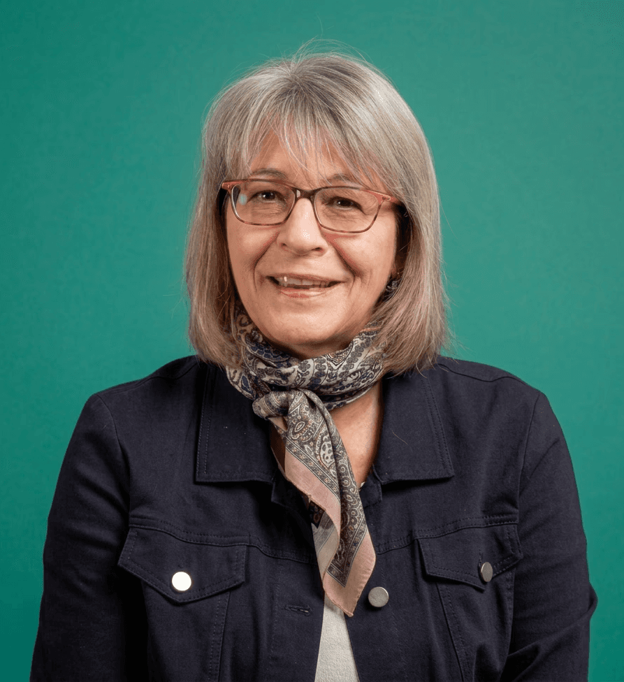 selective focus photography of woman with brown wooden wall background