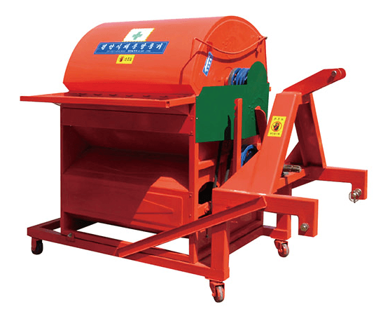 A blank white card resting on a softly draped rust-colored fabric atop a beige quilted surface.